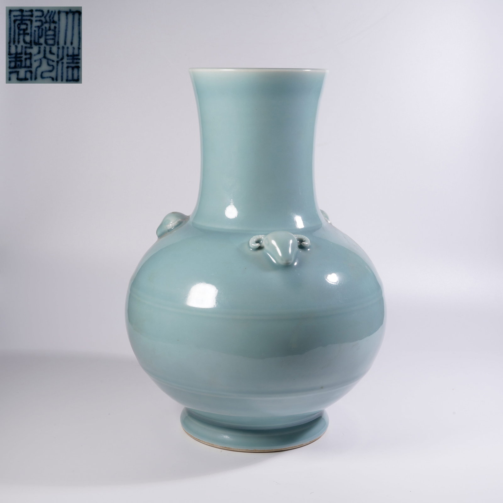A SKY-BLUE GLAZED SANYANG ZUN VASE: Sky-blue glazed sanyang zun vase