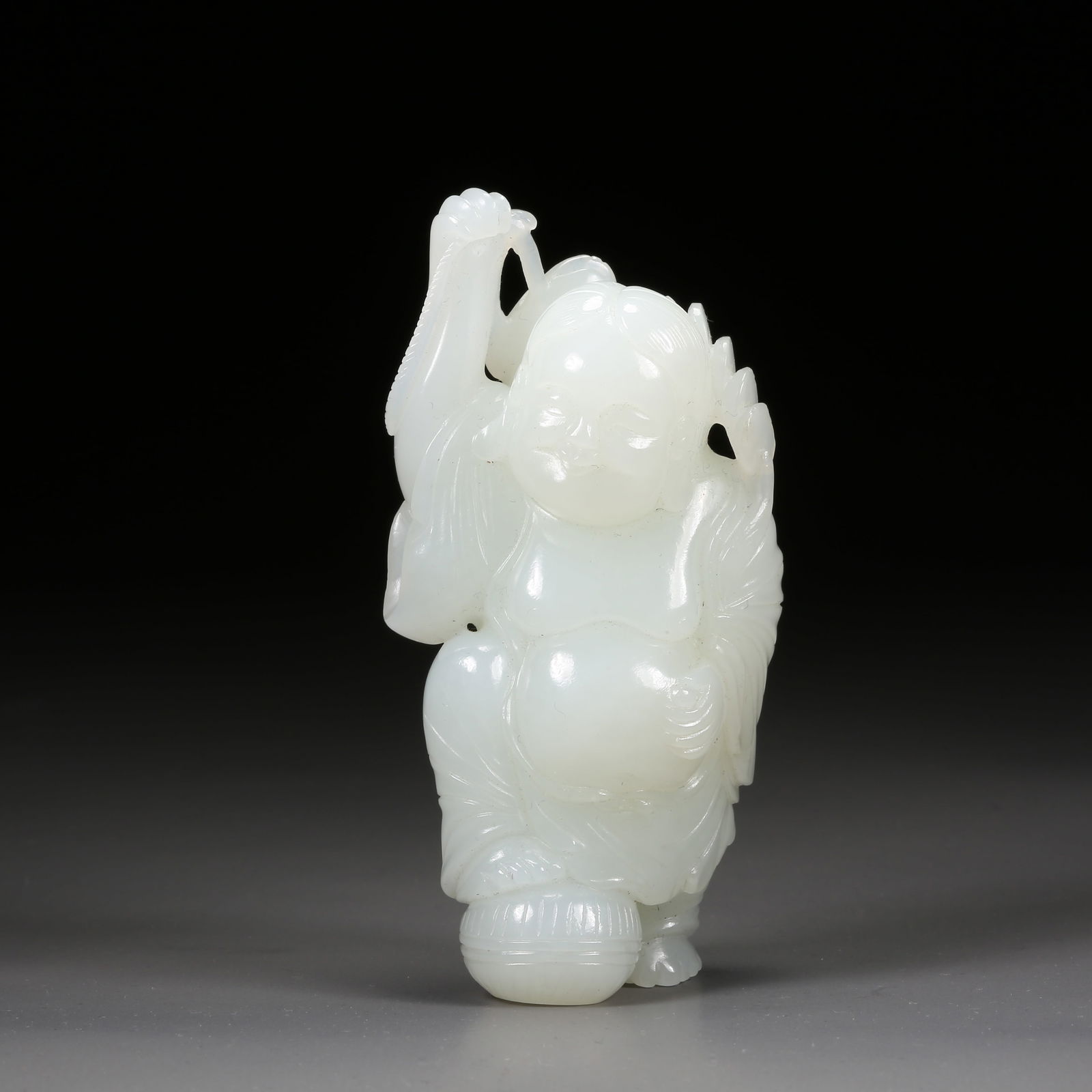 A HETIAN WHITE JADE FISHERMAN FIGURINE: Hetian White Jade Fisherman Figurine