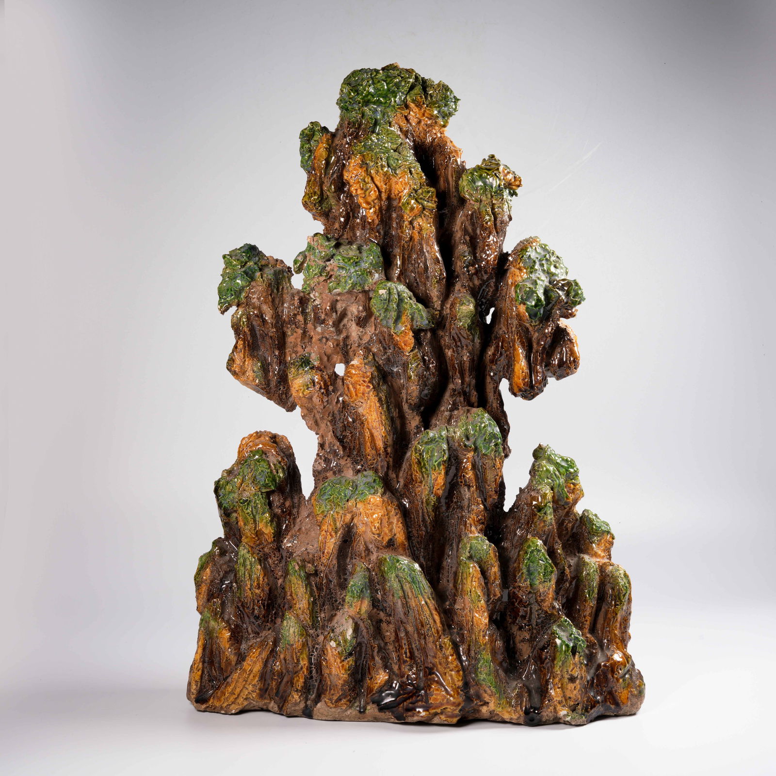 A PLAIN SANCAI MOUNTAIN-FORM ORNAMENT: Plain Sancai Mountain-Form Ornament