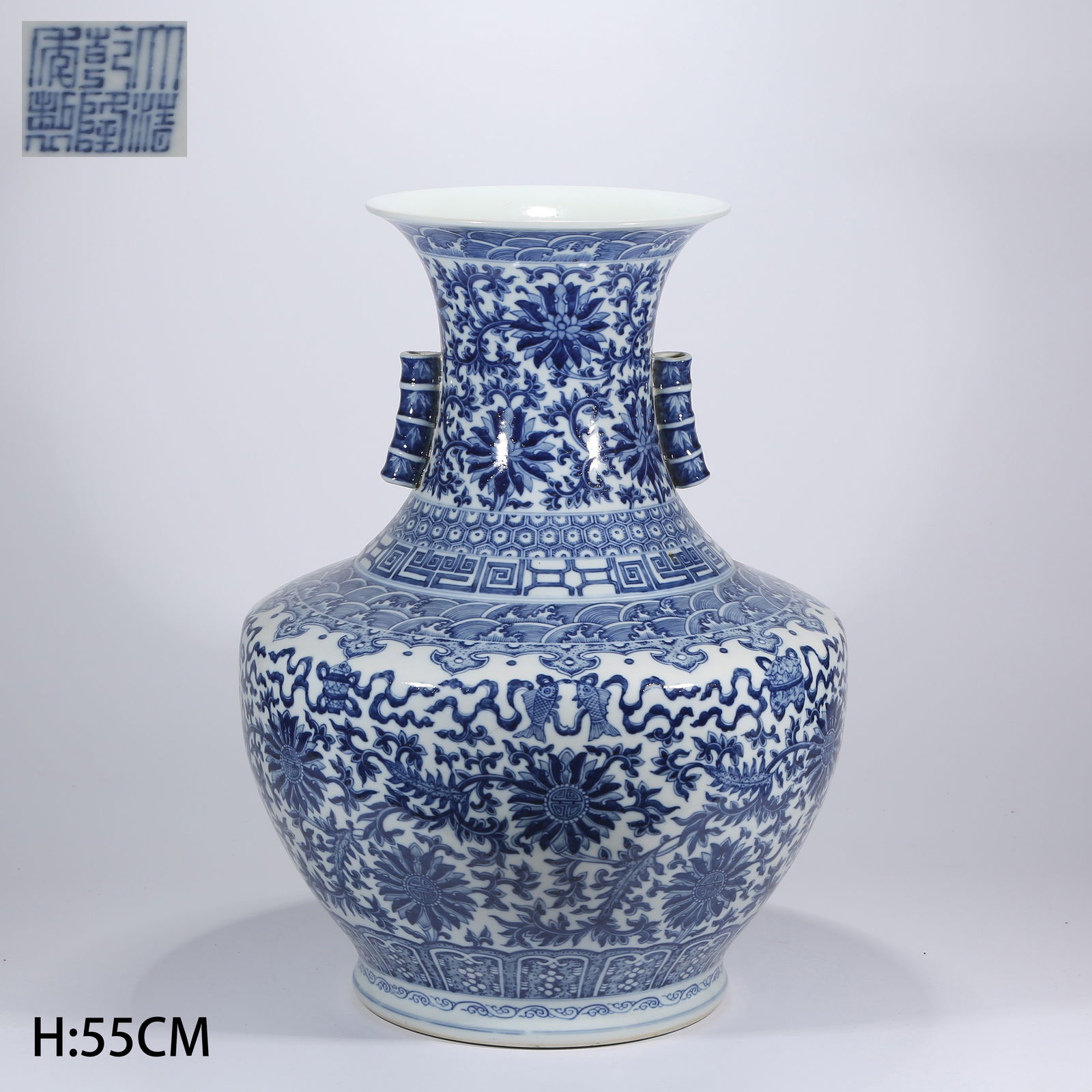 A BLUE-AND-WHITE VASE WITH LAPPET-HANDLED VINE AND FLORAL PATTERN: Blue-and-White Vase with Lappet-Handled Vine and Floral Pattern