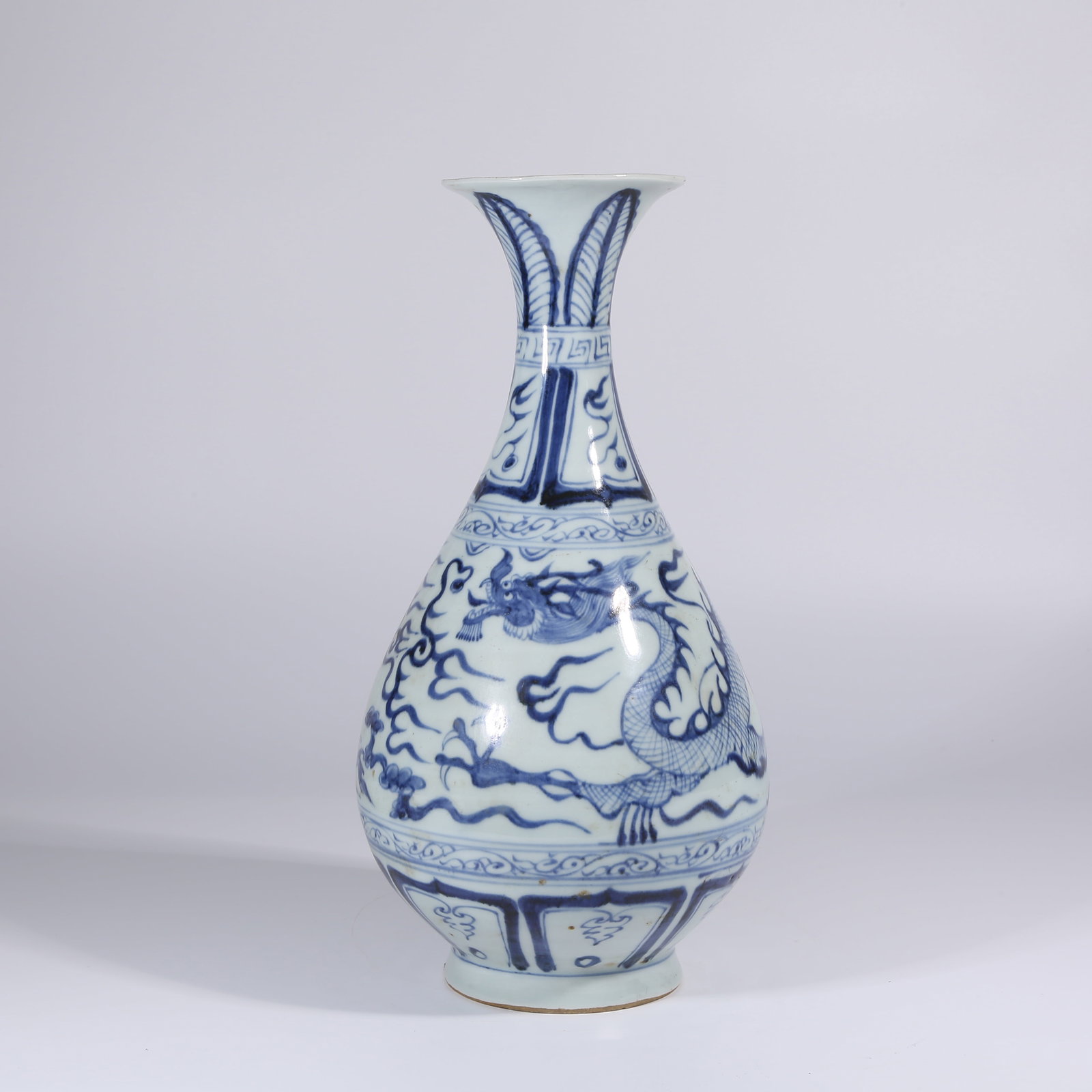 A BLUE AND WHITE YUHUCHUN VASE WITH CLOUD AND DRAGON MOTIF: Blue and White Yuhuchun Vase with Cloud and Dragon Motif