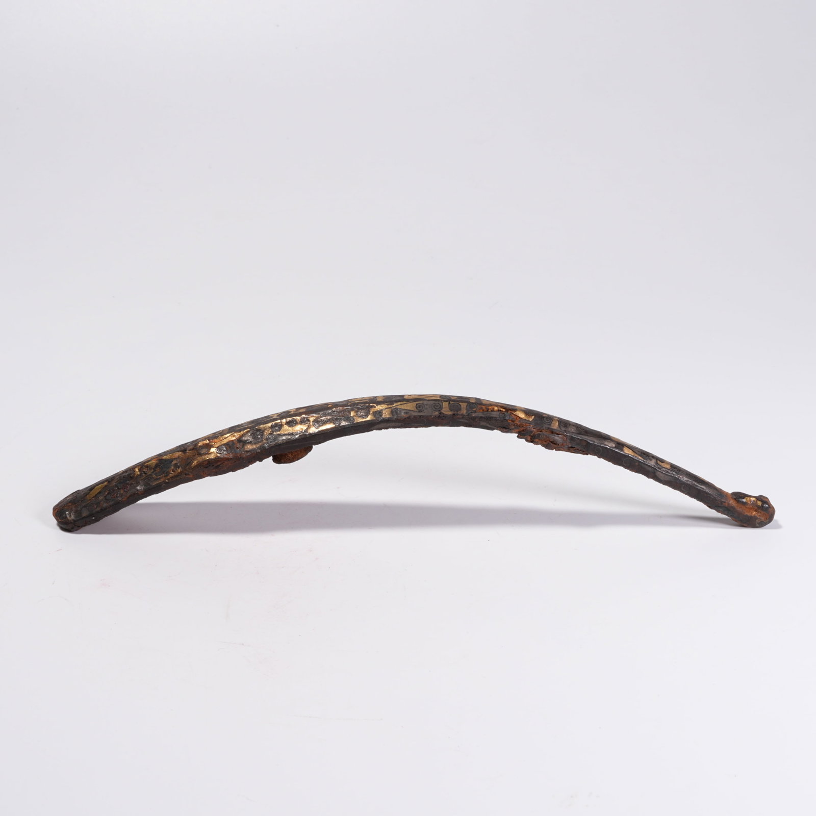 A BRONZE BELT HOOK INLAID WITH GOLD: Bronze Belt Hook Inlaid with Gold