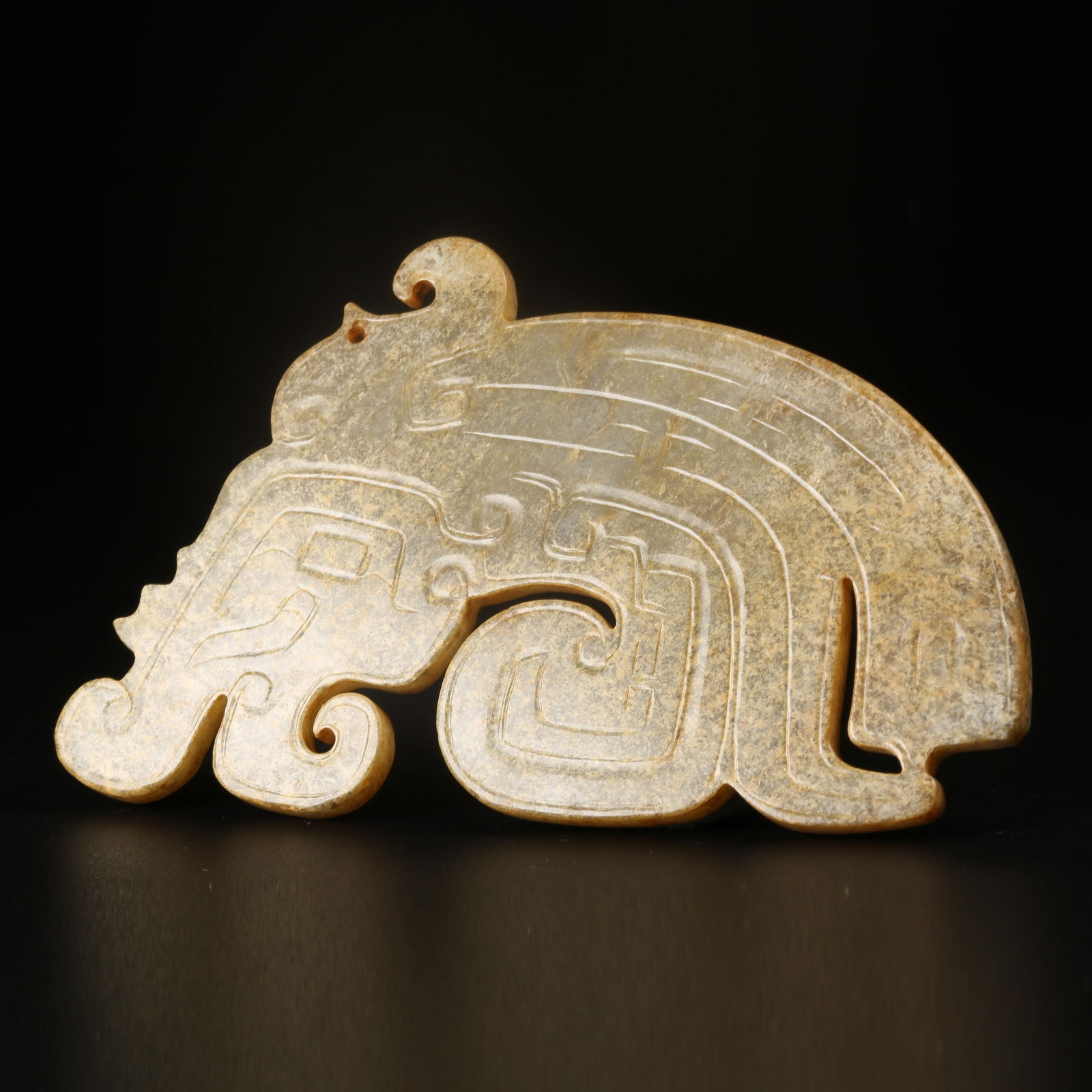 A ARCHAIC JADE AUSPICIOUS BEAST PENDANT: Archaic Jade Auspicious Beast Pendant