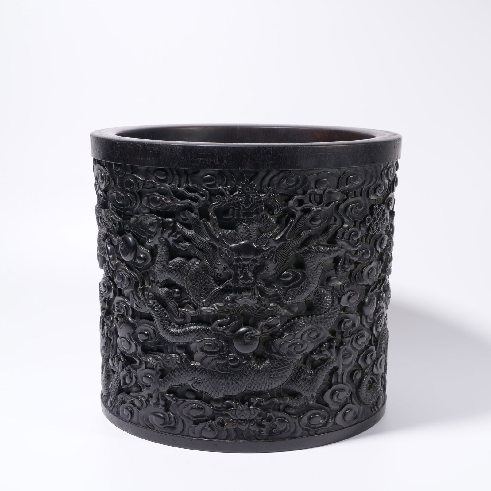 A ZITAN WOOD CARVING CLOUD AND DRAGON-PATTERN BRUSH HOLDER: Zitan Wood Carving Cloud and Dragon-Pattern Brush Holder