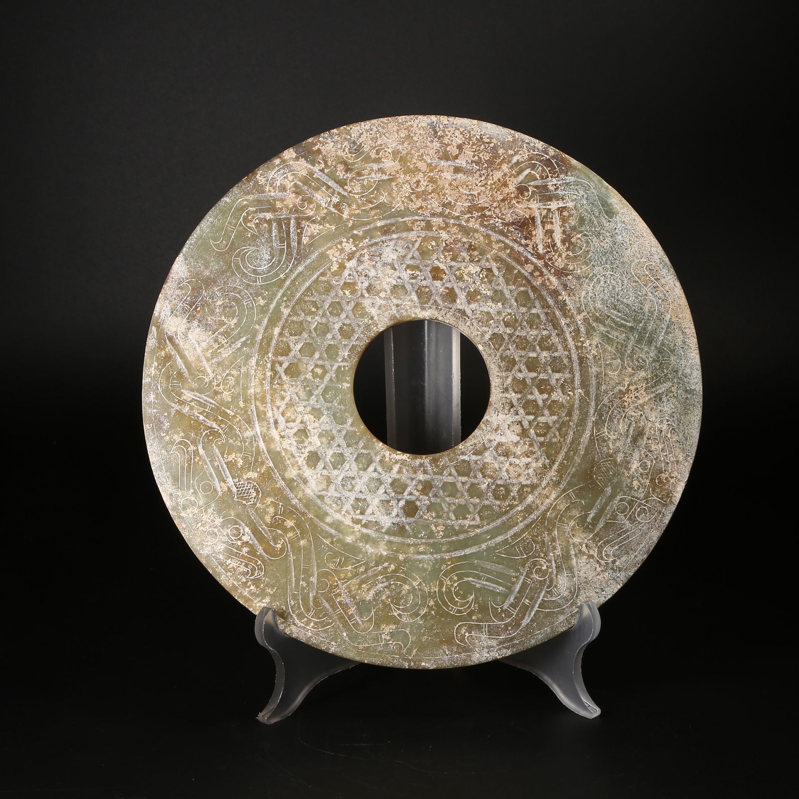 A ANCIENT JADE BI DISK WITH BEAST-FACE MOTIF (1 of 10)