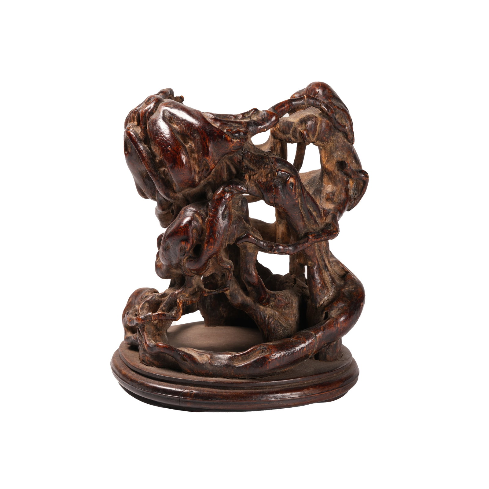 OPENWORK CARVED QINAN AGARWOOD PINE-ROOT-SHAPED FLOWER VASE WITH INTERLOCKING BRANCH PATTERN, QING: This flower vase is exquisitely openwork-carved from a whole piece of rare agarwood, modeled after natural pine roots and twisting vines. The winding branches are intricately arranged with delicate ho