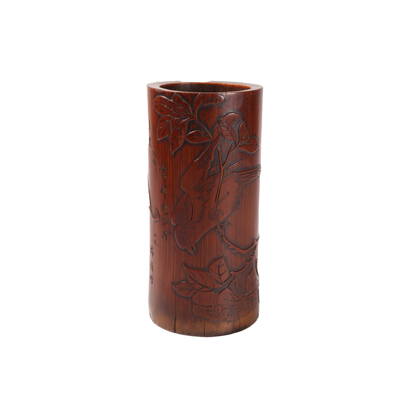 BAMBOO CARVED BRUSH POT WITH FLOWER AND BIRD PATTERN INSCRIBED XIYAN PRESENTED TO YUNXIANG, QING: This fine bamboo carved brush pot dates back to the Tongzhi reign of the Qing Dynasty. It features a neat and upright straight cylindrical shape. Made of solid fine bamboo, it has developed warm amber