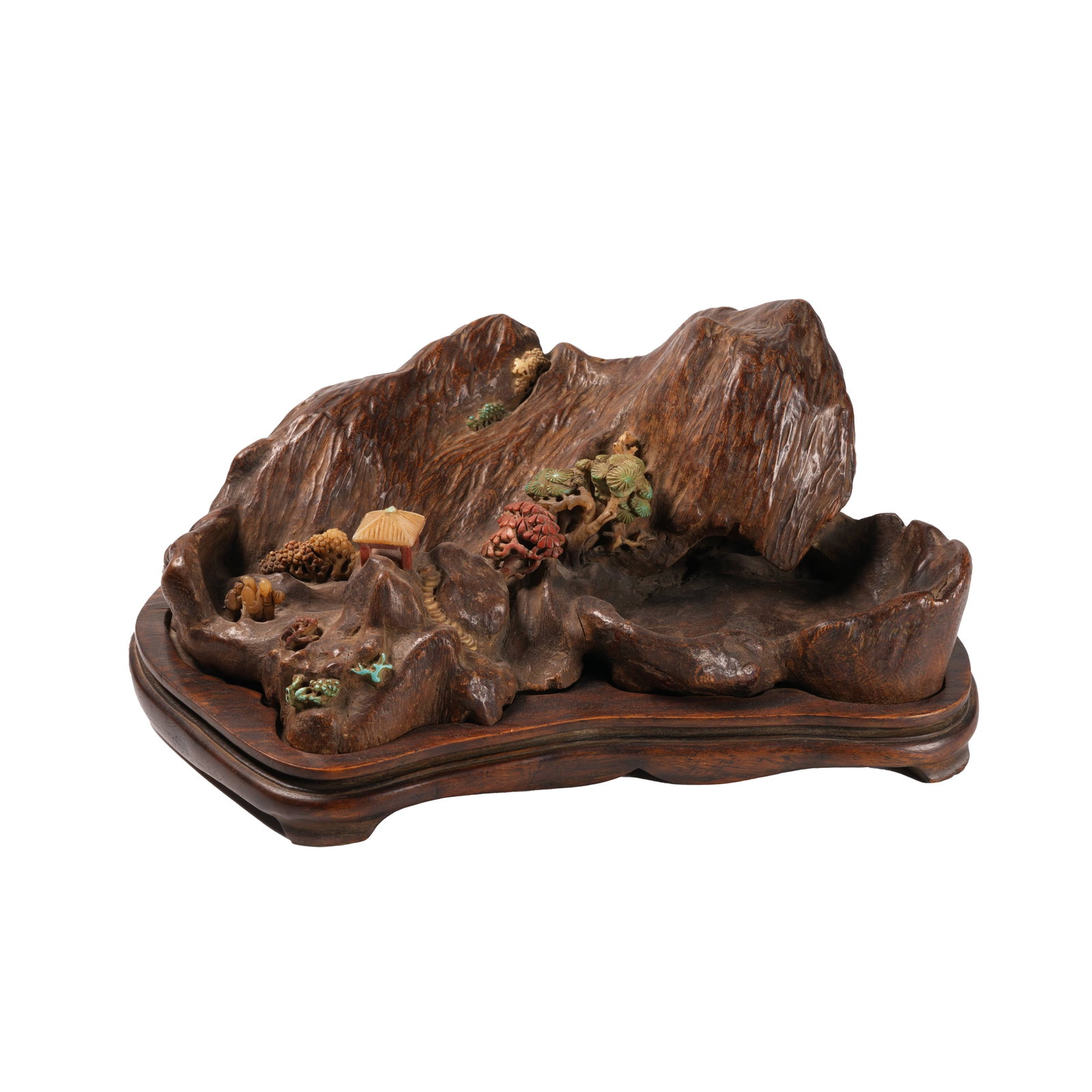 TREASURE-INLAID AGARWOOD MOUNTAIN ORNAMENT CARVED WITH LANDSCAPE AND FIGURES, QING DYNASTY: This distinguished Qing Dynasty studio ornament is carved from whole agarwood into mountain shape with naturally undulating contours and textures mimicking natural rock veins in simple elegant carving