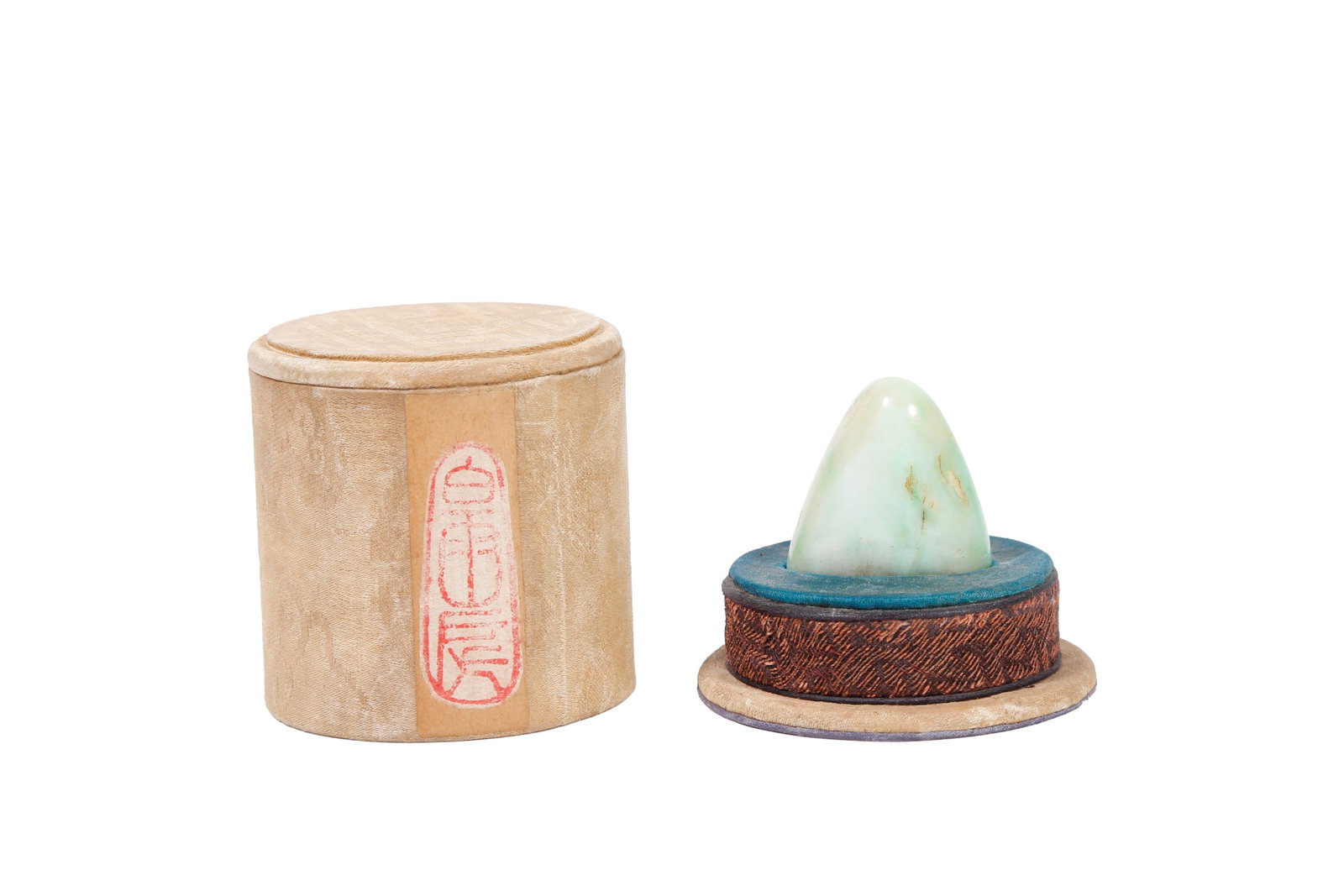 NATURAL-SHAPED JADEITE SEAL, QING DYNASTY: This irregular leisure seal is naturally carved from raw jadeite stone. It features mild and fine texture with natural stone veins and smooth natural aged patina. The oval seal face is engraved with r