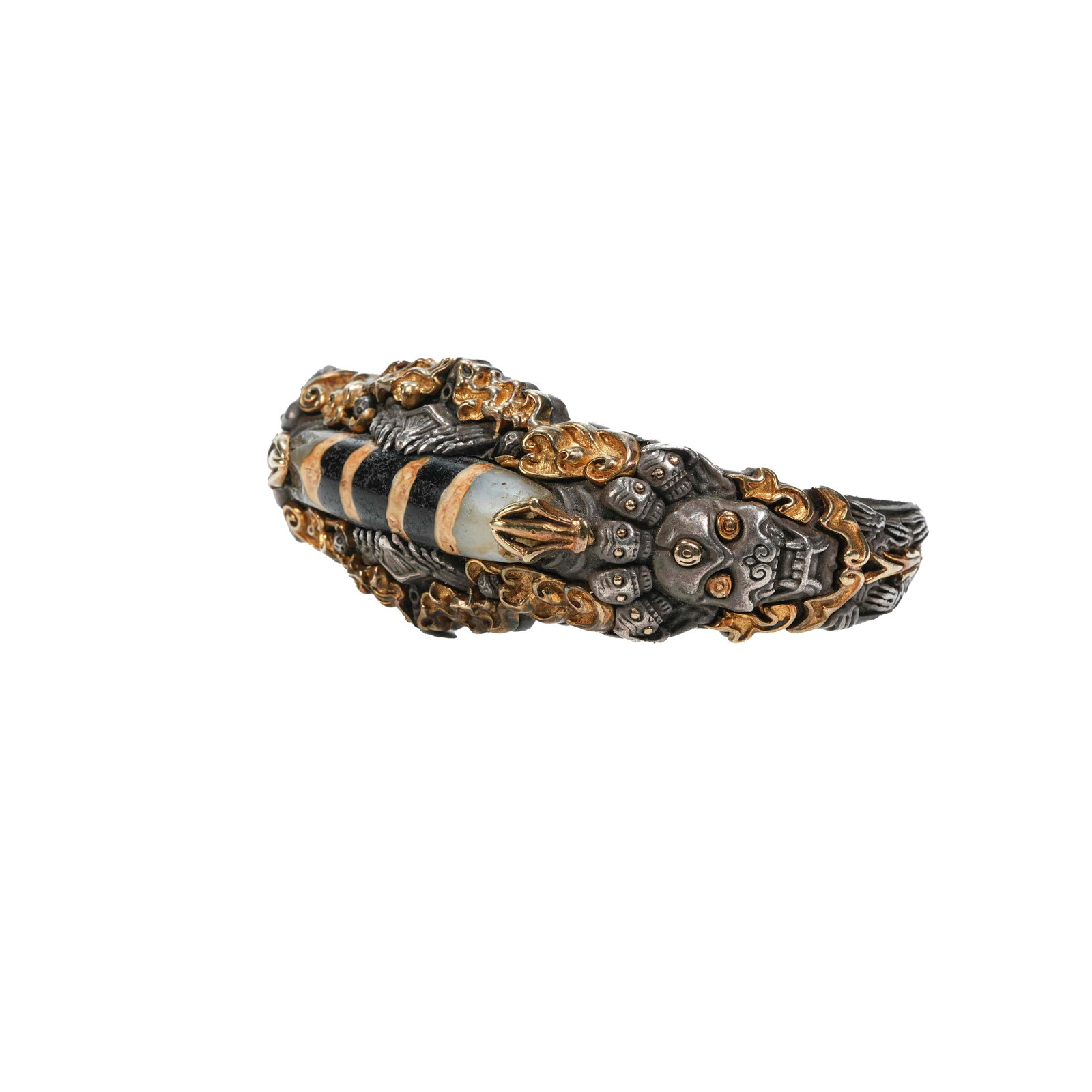 GILT SILVER SHITAVANA BRACELET INLAID WITH DZI BEADS, QING DYNASTY: Silver-gilt bracelet in Tibetan Buddhist style centers on ancient thousand-year line dzi bead. Built on silver body with partial gilding, it is exquisitely wrought. Designed with Citipati theme, it is
