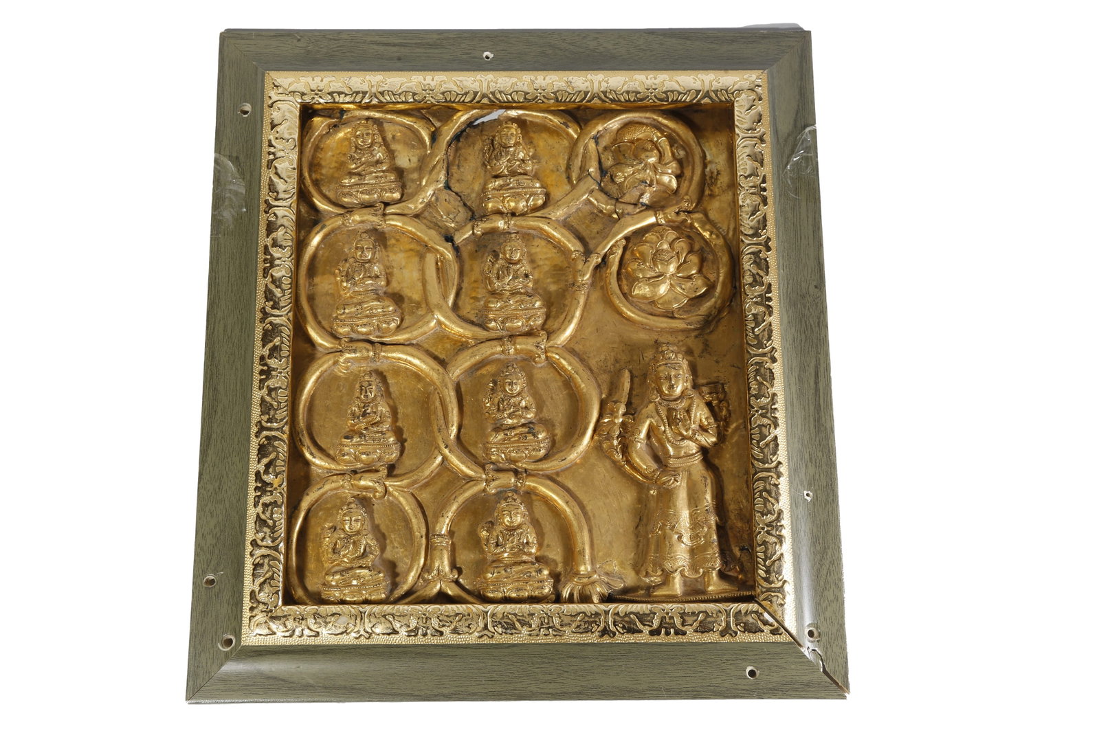 GILT BRONZE MANDALA PLAQUE OF EIGHT MEDICINE BUDDHAS AND DHARMA PROTECTORS, QING DYNASTY: This is a gilt bronze plaque ornament themed on Tibetan Buddhist mandala, crafted by hammering and chiseling techniques and fully gilded all over. The plaque surface is divided into neat sections by i