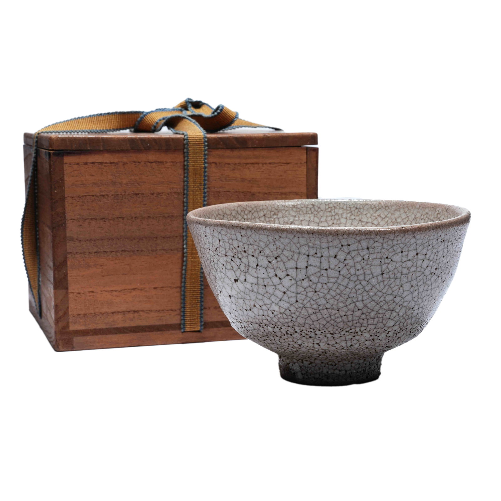 KARAKATSU WARE GE-TYPE CRACKLE MATCHA BOWL, EARLY SHOWA PERIOD: The entire vessel is covered in imitation Ge glaze covered with fine natural crackles. It presents mild greyish-white glaze tone with thick antique body and full well-proportioned shape. It is matched