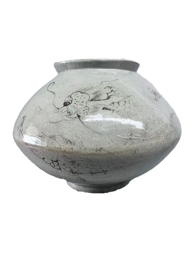 JOSEON WHITE PORCELAIN IRON-PAINTED CLOUD AND DRAGON PATTERN JAR: This is a classic handed-down iron-painted white porcelain jar of the Joseon Dynasty of Korea from the 17th to 18th centuries. It has a full and rounded shape with short neck, full shoulders, bulging 