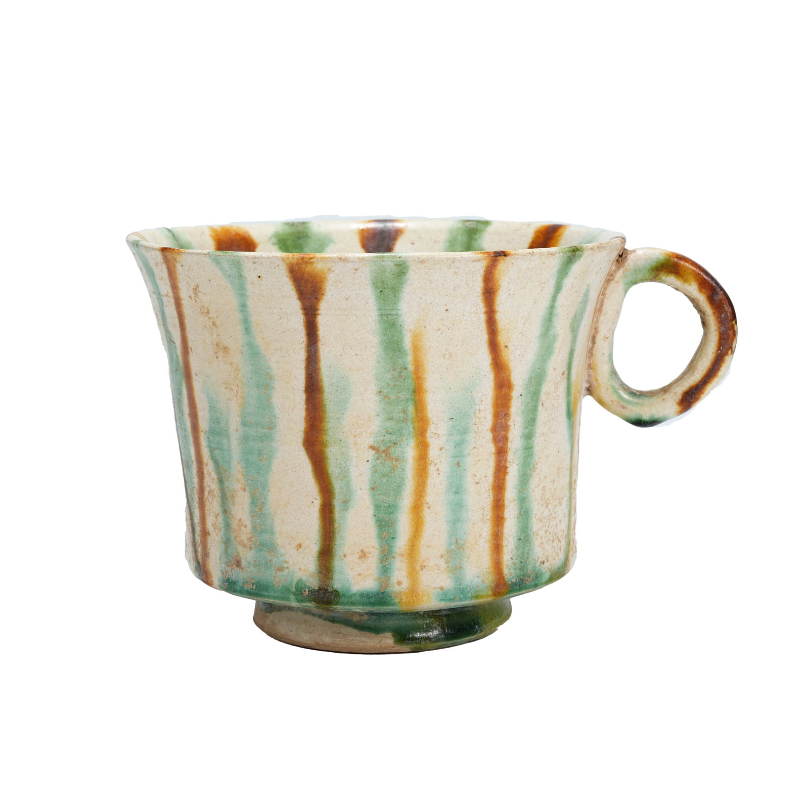 TRI-COLOR SINGLE-HANDLED CUP, TANG DYNASTY: This practical Tang Dynasty sancai wine vessel is trumpet-shaped with open mouth, slanting walls and tapered base, and equipped with a circular handle on one side. It has smooth and graceful lines, co