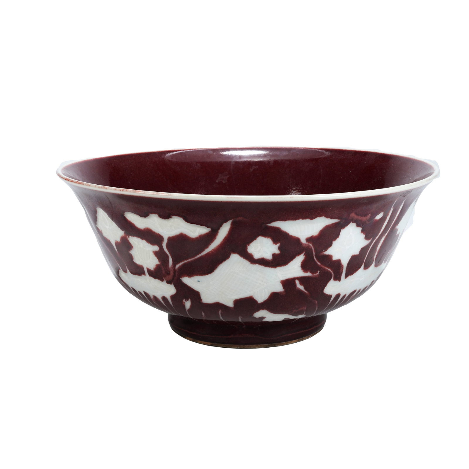 SACRIFICIAL RED GLAZED BOWL WITH RESERVED WHITE FISH AND ALGAE PATTERN, XUANDE PERIOD MING DYNASTY: This Sacrificial Red Glazed Bowl with reserved white fish and algae patterns dates back to the Xuande reign of the Ming Dynasty. Its base is inscribed with six-character regular script reign mark "Mad