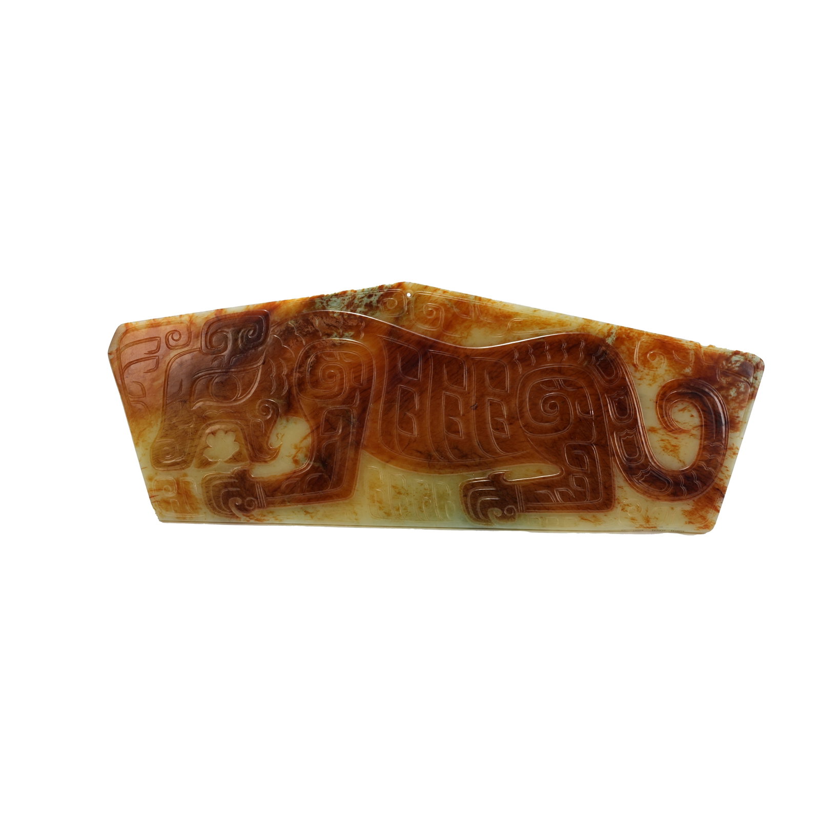 TIGER PATTERN JADE PENDANT, WESTERN ZHOU DYNASTY: A typical tiger-patterned jade ornament of the Western Zhou Dynasty, finely carved from premium white Hotan jade, is fully permeated with layered reddish-brown patina that blends harmoniously with the