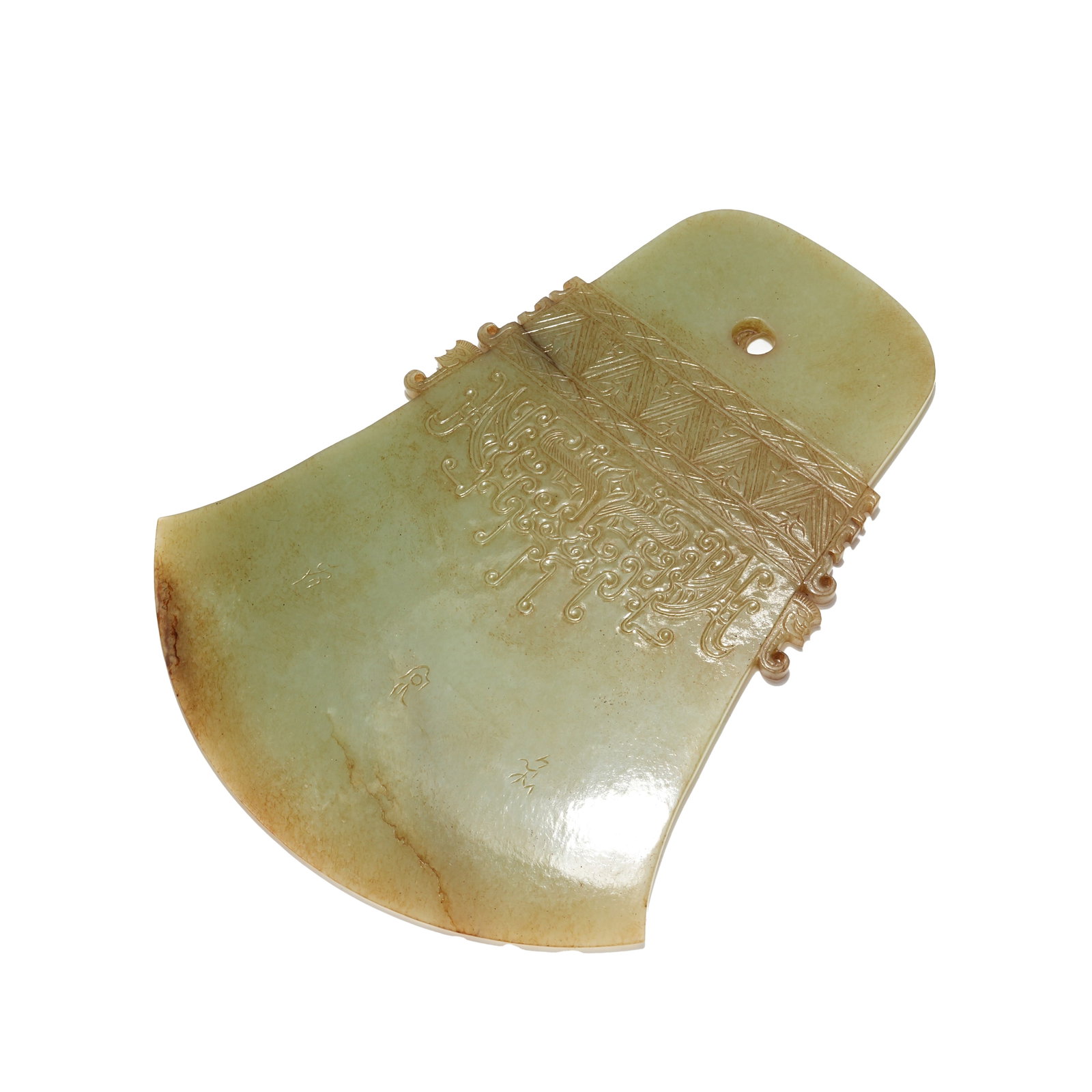 TOPAZ JADE YUE AXE CARVED WITH DIVINE FACIAL PATTERN, SHANG DYNASTY: The jade yue is a high-grade ritual vessel of the Shang Dynasty, carved from superior yellow Hotan jade. It features mild and fine texture in soft pale yellow tone with natural patina and fine cracks 