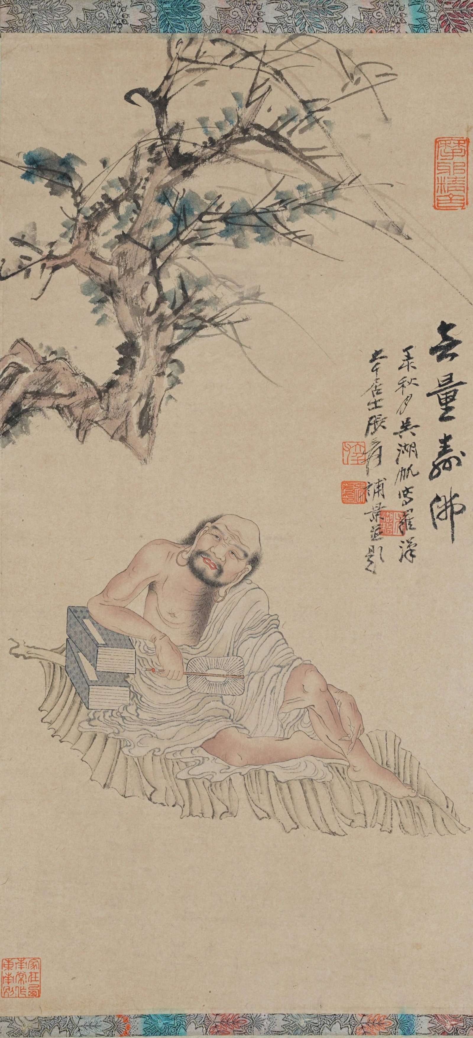 JOINT PAPER PAINTING AMITAYUS BUDDHA BY WU HUFAN AND ZHANG DAQIAN.吴湖帆·: Amitayus Buddha jointly painted by Wu Hufan and Zhang Daqian, colored on paper. The painting shows an eminent monk leaning leisurely on a rush cushion, with scriptures and palm fans placed beside him.