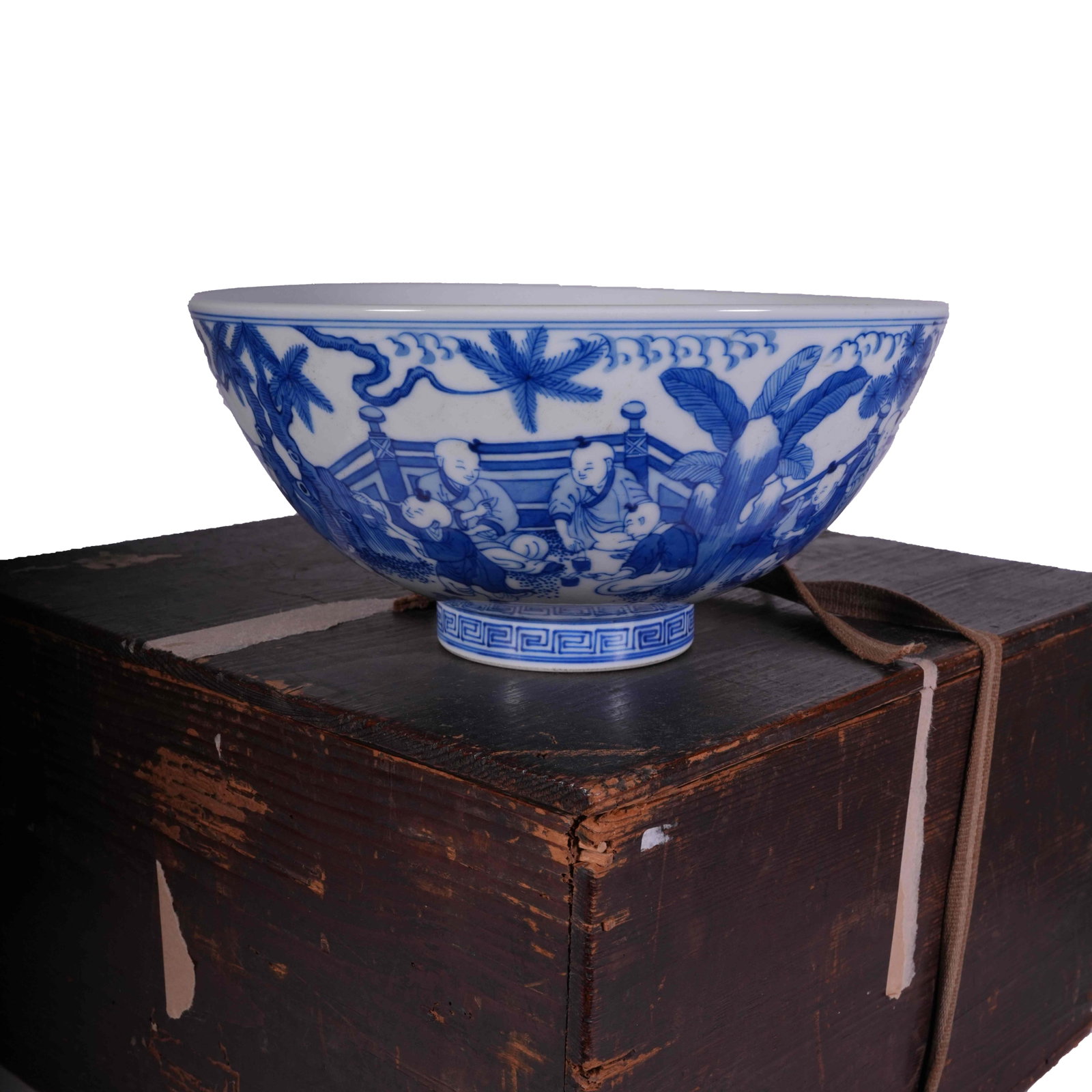 CHENGHUA PERIOD BLUE AND WHITE BOWL WITH CHILDREN PLAYING PATTERN MING DYNASTY: This is a blue and white porcelain bowl with flared mouth and curved belly. The exterior is fully painted with a continuous scene of children at play. Vivid kids frolic in courtyard scenery