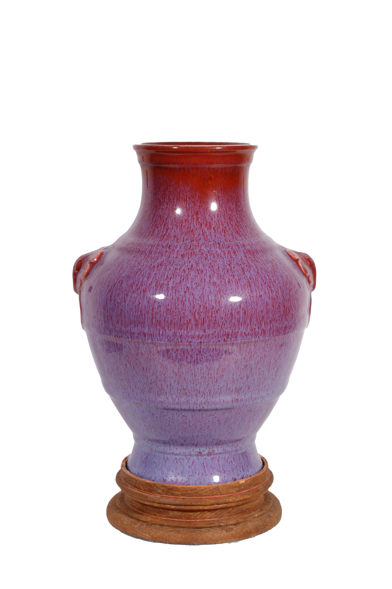 YONGZHENG PERIOD FLAMBE GLAZED ZUN VASE WITH BEAST EARS AND STRING PATTERNS QING DYNASTY: This is a transmutation glaze beast-ear string-patterned zun vessel fired by Jingdezhen Imperial Kiln during the Yongzheng reign of the Qing Dynasty. Modelled after ancient bronze ritual vessels, it f