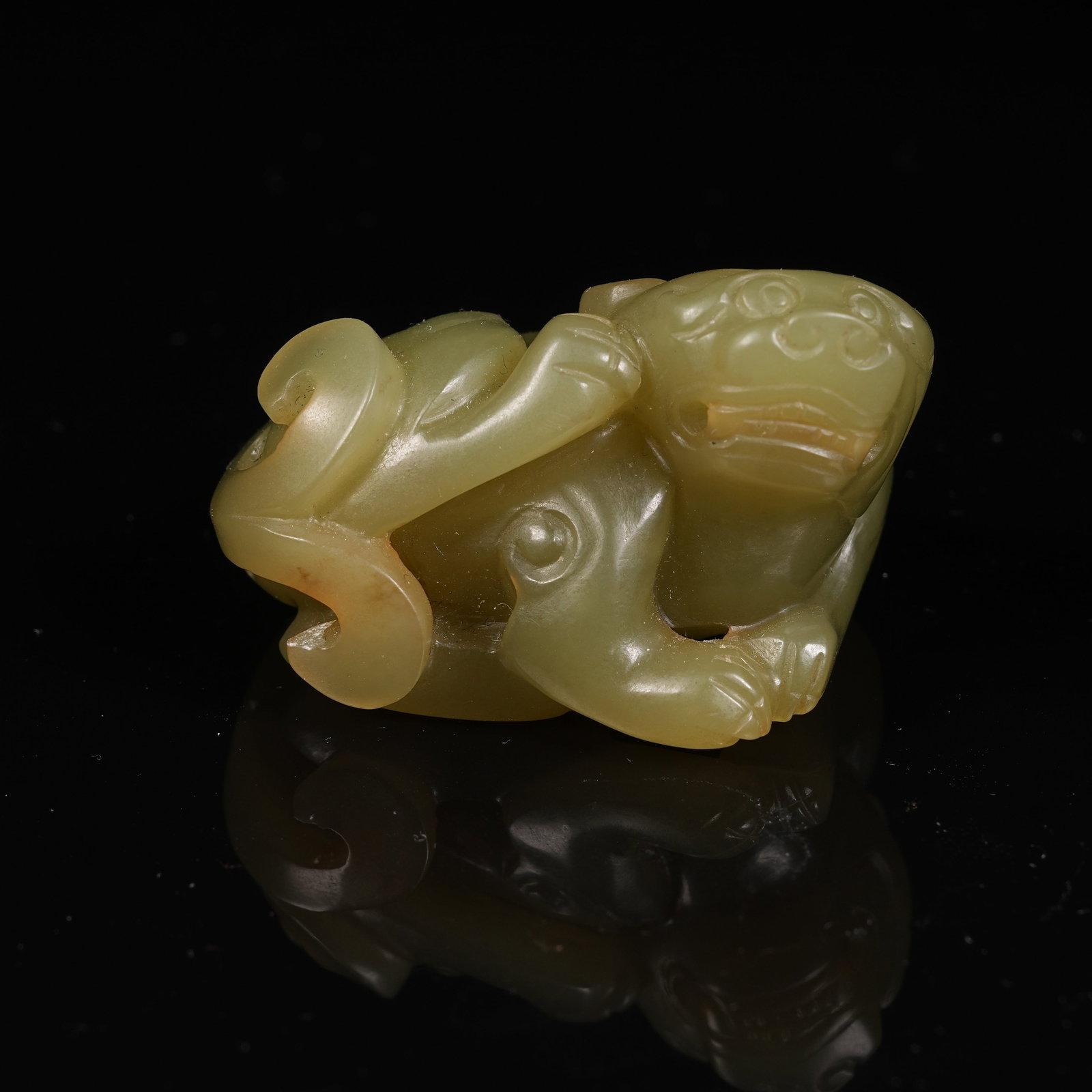 A HETIAN YELLOW JADE RECLINING BEAST PENDANT (1 of 8)