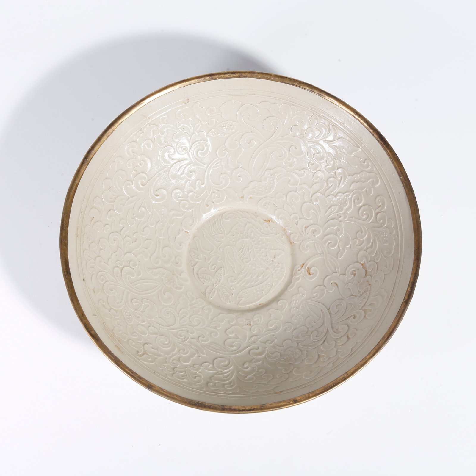 A DING KILN BOWL WITH FLORAL PATTERN (1 of 10)