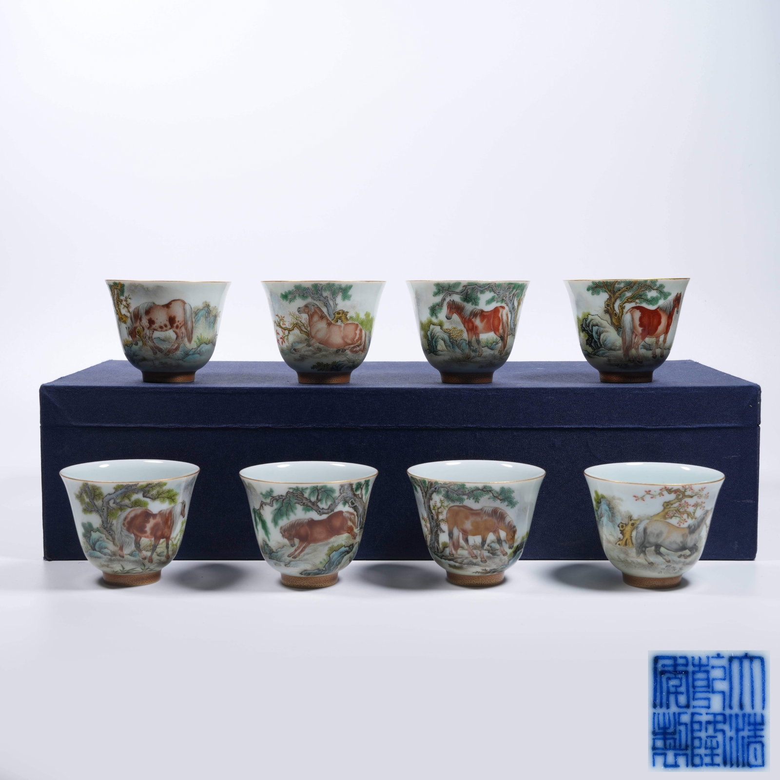 A SET OF EIGHT FAMILLE ROSE CUPS WITH EIGHT HORSES PATTERN: Set of Eight Famille Rose Cups with Eight Horses Pattern