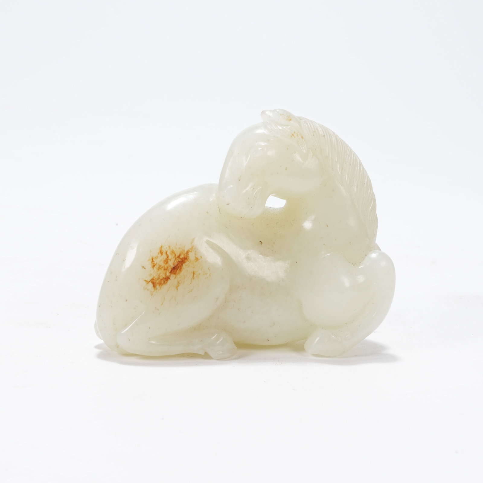 A HETIAN JADE RECUMBENT HORSE HAND PIECE (1 of 8)