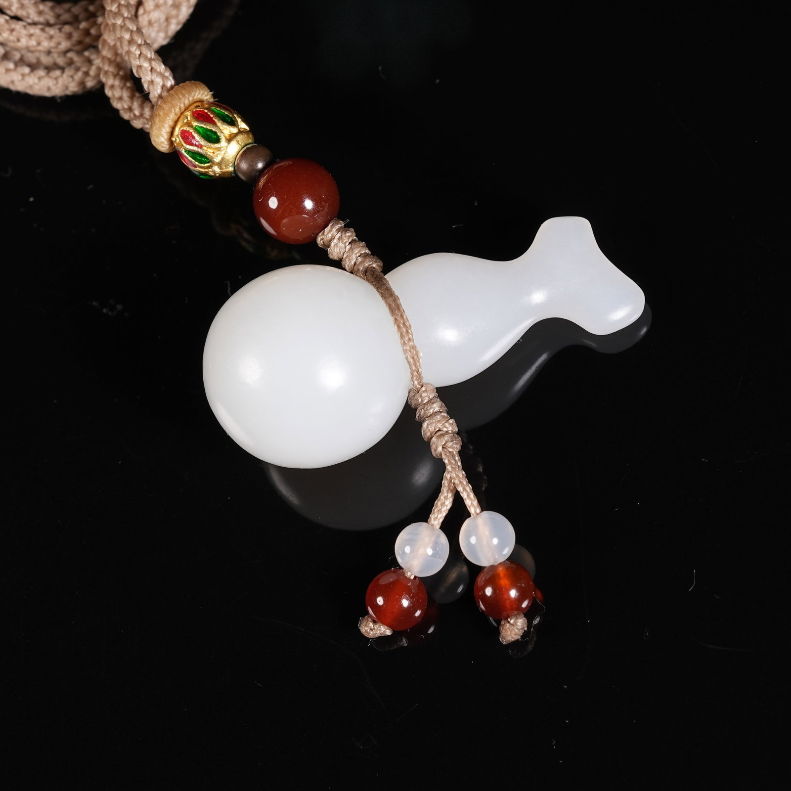 A WHITE HETIAN JADE ETERNAL BLESSING AND FORTUNE PENDANT: White Hetian Jade Eternal Blessing and Fortune Pendant