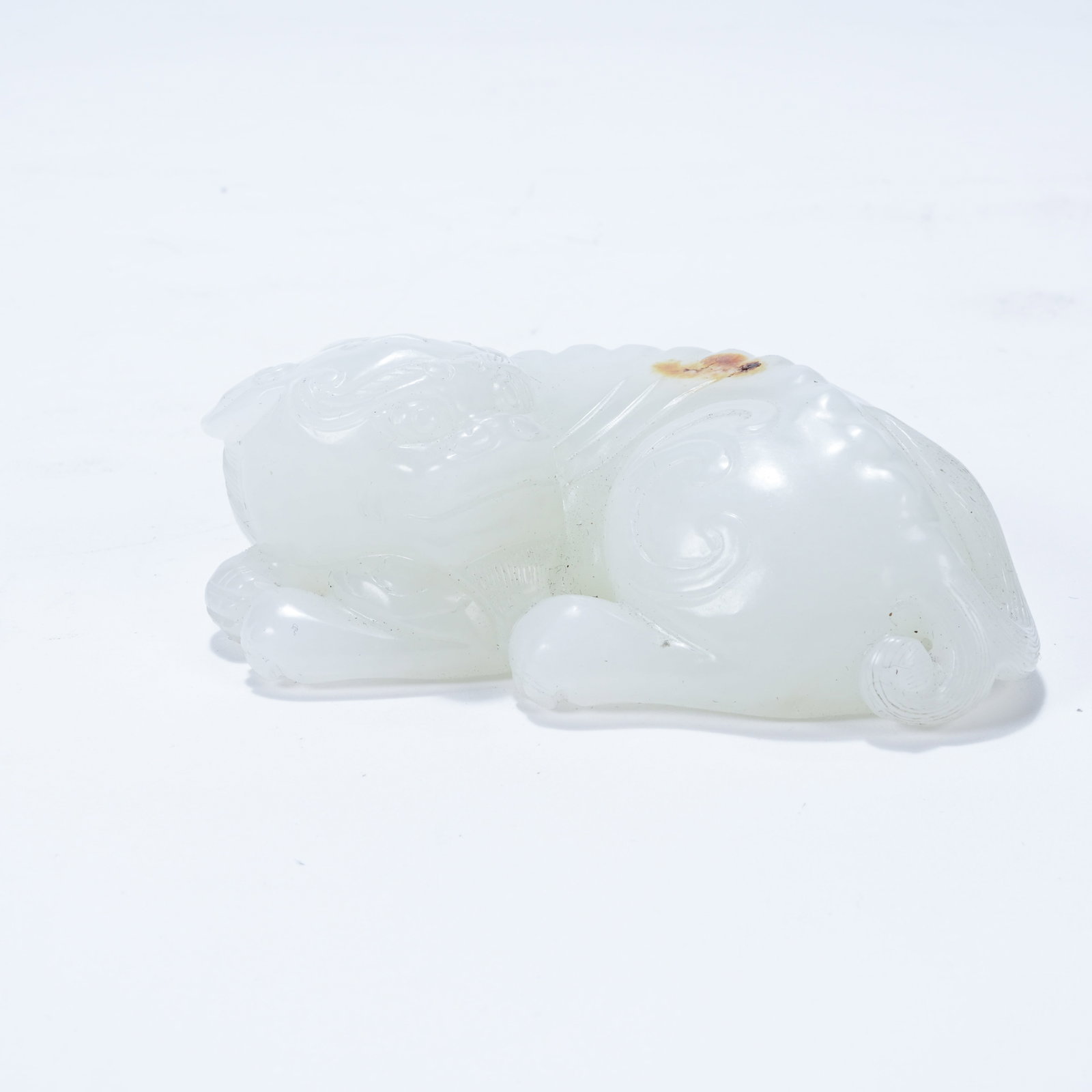 A HETIAN JADE RECUMBENT BEAST ORNAMENT (1 of 8)