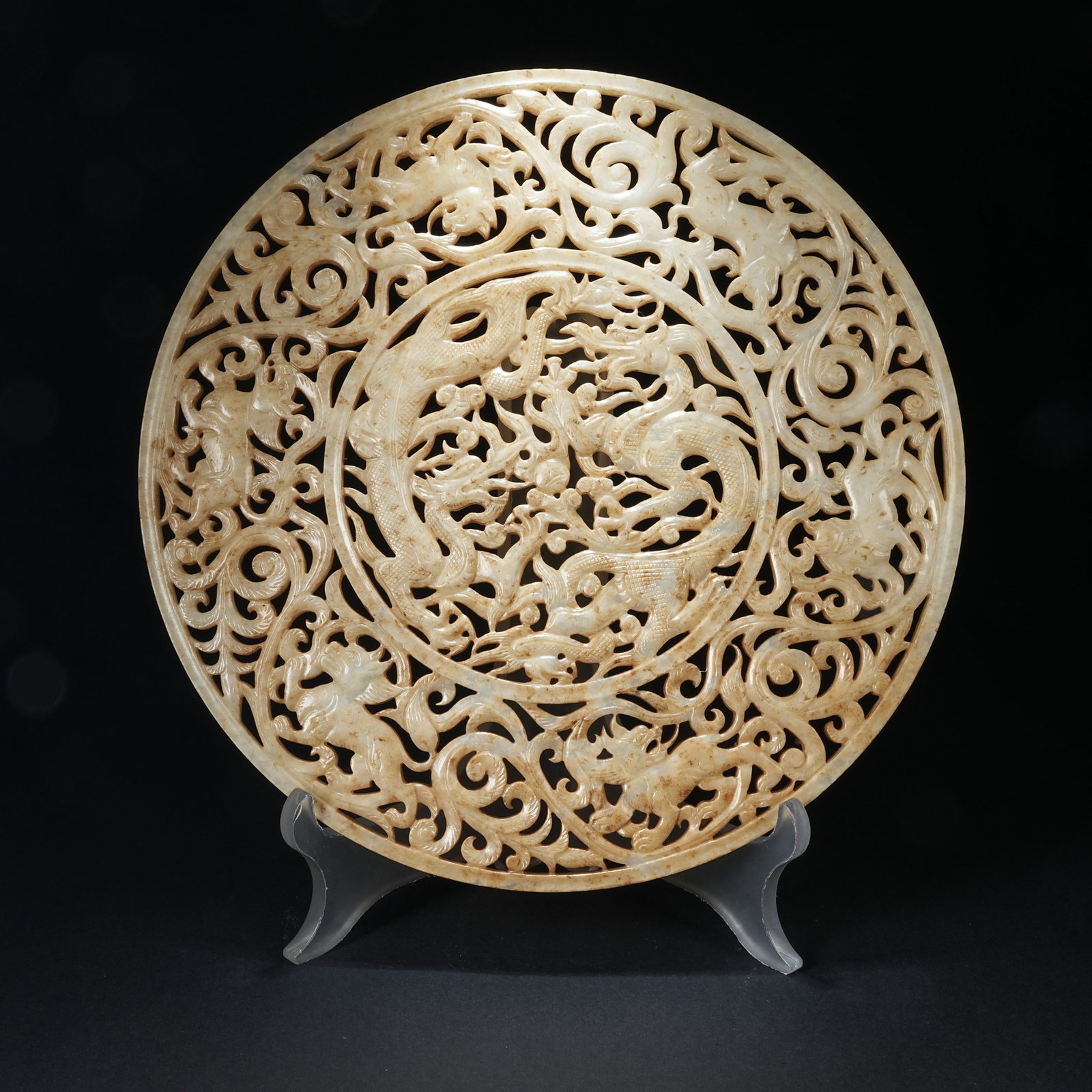 A ANCIENT JADE BI DISC WITH DRAGON AMIDST FLORAL PATTERN (1 of 10)