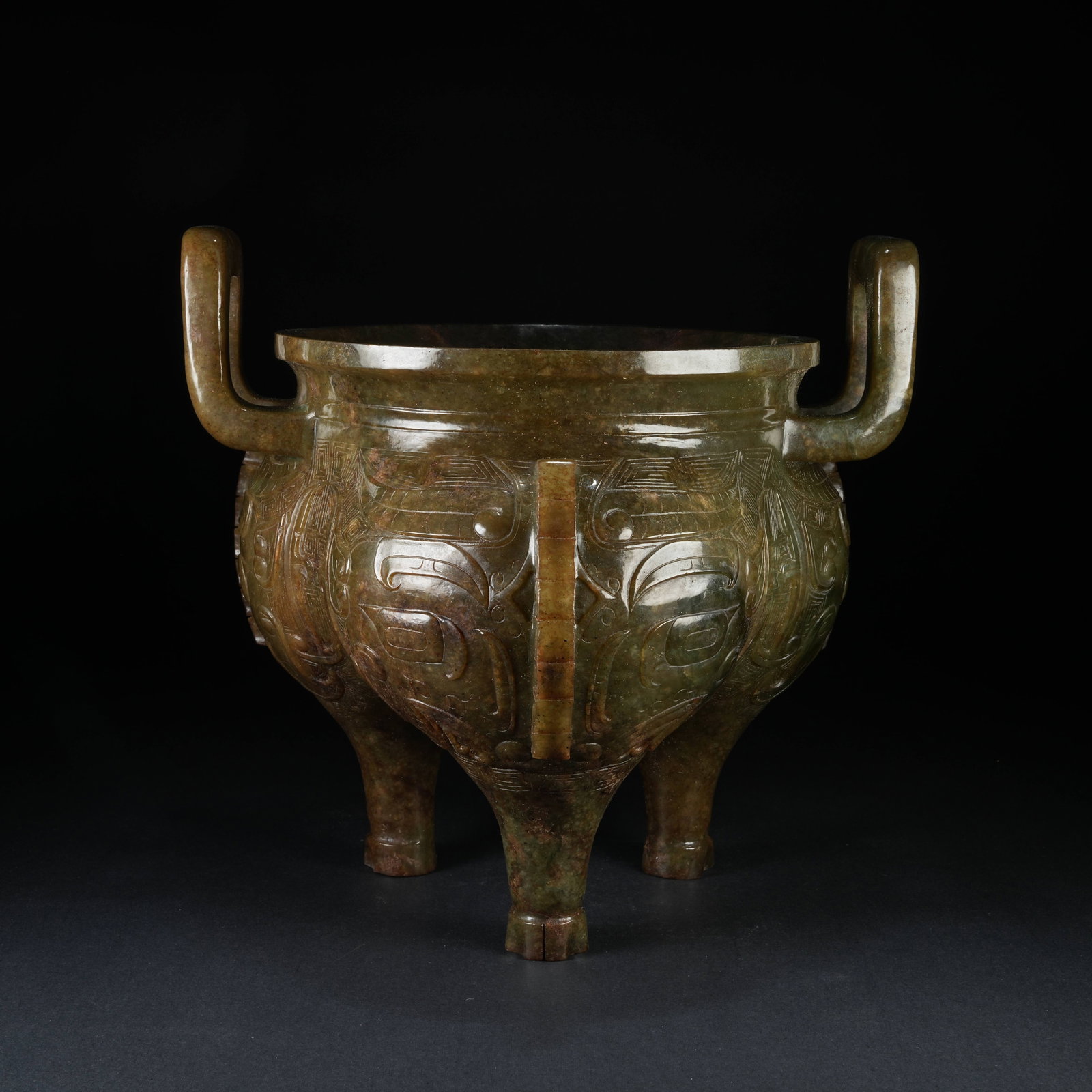 A ANCIENT JADE TRIPOD CENSER WITH BEAST MASK PATTERN, FLANGED PANELS AND DYNASTY CROWN EARS (1 of 9)