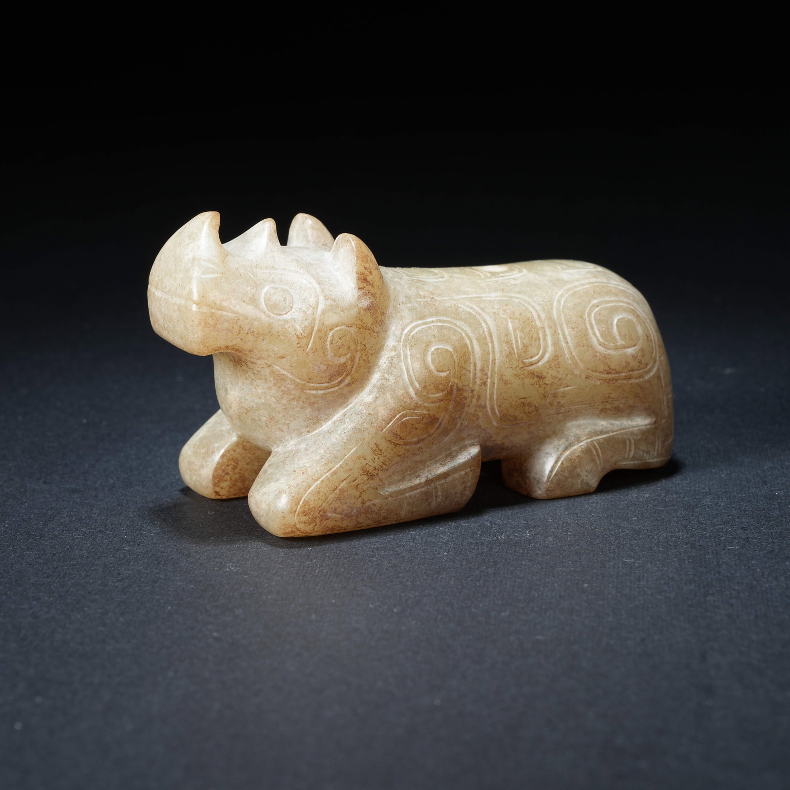 A ANCIENT JADE RECLINING BEAST PENDANT (1 of 8)