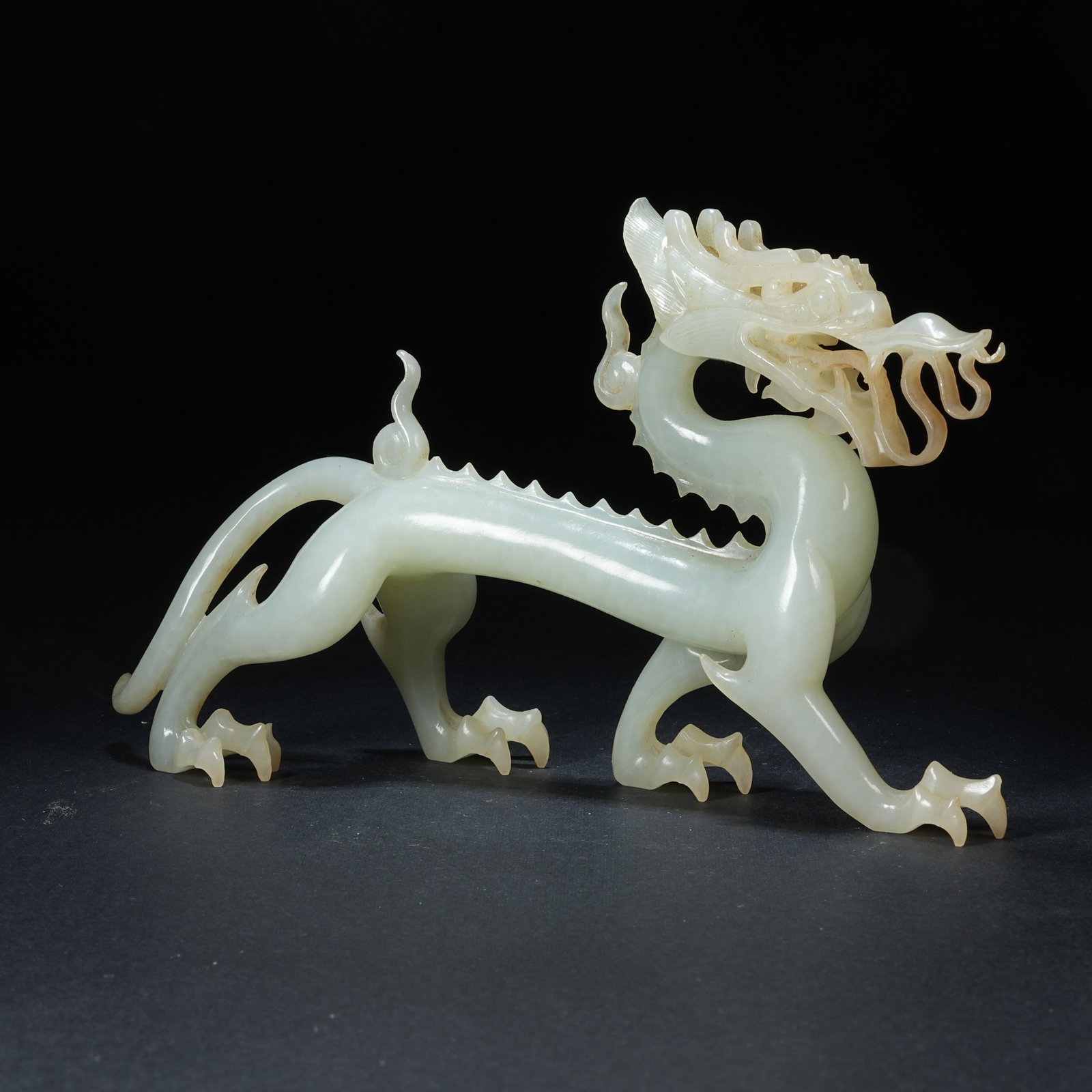 A HETIAN JADE WALKING DRAGON ORNAMENT: Hetian Jade Walking Dragon Ornament