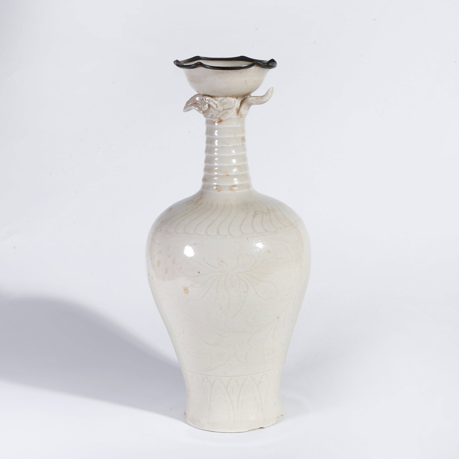 A DING KILN FLOWER-MOUTH VASE WITH FLORAL PATTERN: Ding Kiln Flower-mouth Vase with Floral Pattern