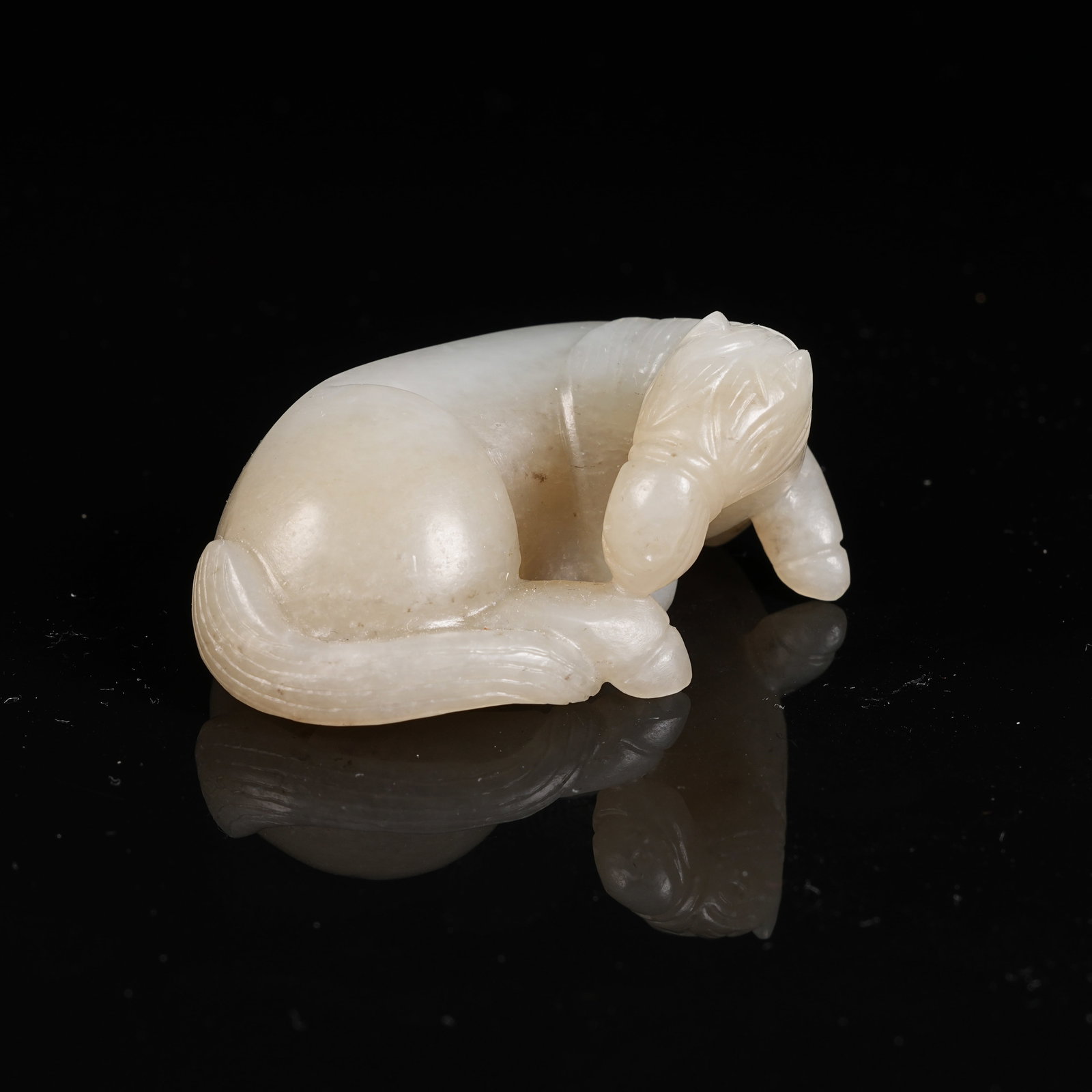 A HETIAN JADE RECLINING HORSE PENDANT (1 of 8)