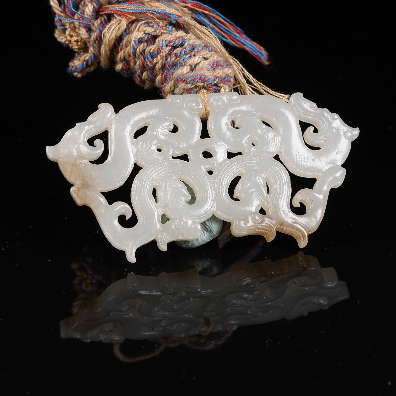 A ANCIENT JADE DOUBLE DRAGON PENDANT (1 of 8)