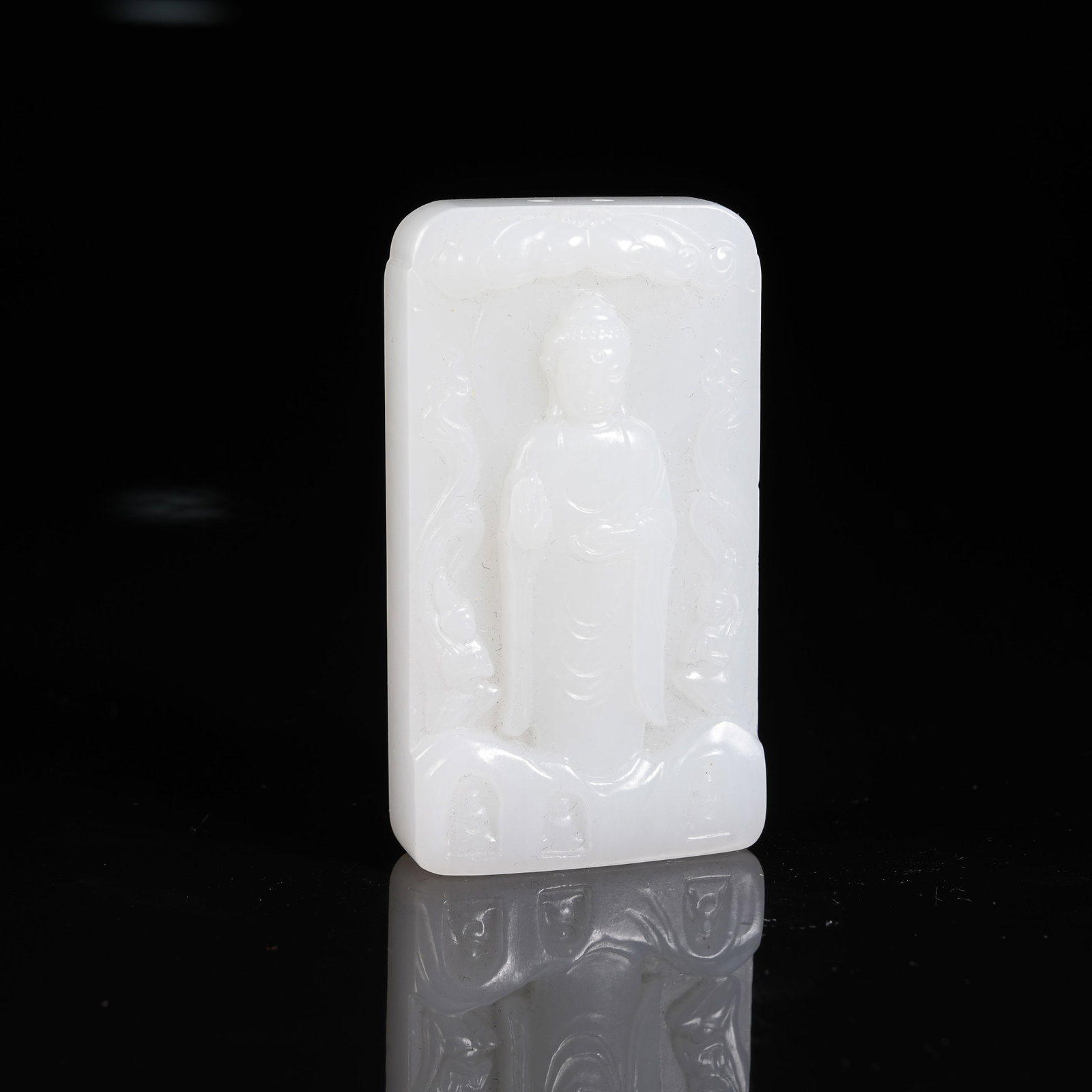 A WHITE HETIAN JADE BUDDHA PATTERN PLAQUE: White Hetian Jade Buddha Pattern Plaque