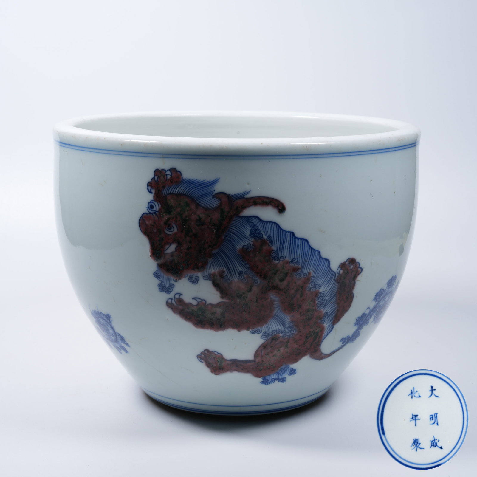 A BLUE AND WHITE UNDERGLAZE RED TABLE JAR WITH AUSPICIOUS LION PATTERN (1 of 10)