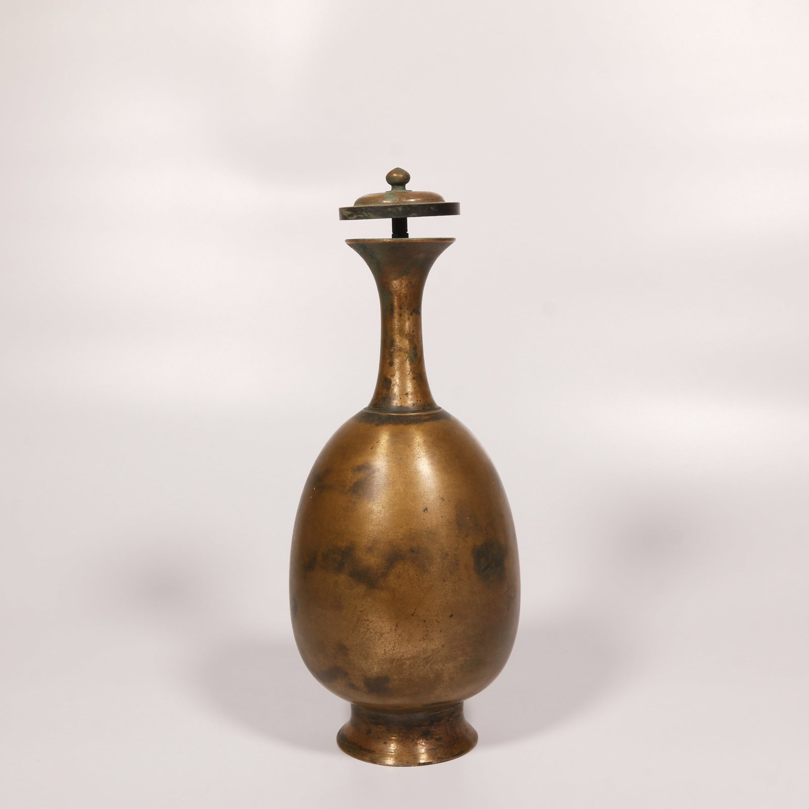 A BRONZE PURIFICATION BOTTLE: Bronze Purification Bottle