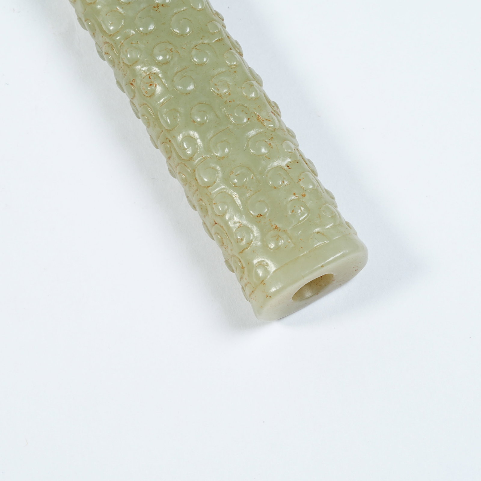 A ANCIENT JADE CYLINDRICAL BEAD WITH INTERLOCKING CLOUD PATTERNS - 3