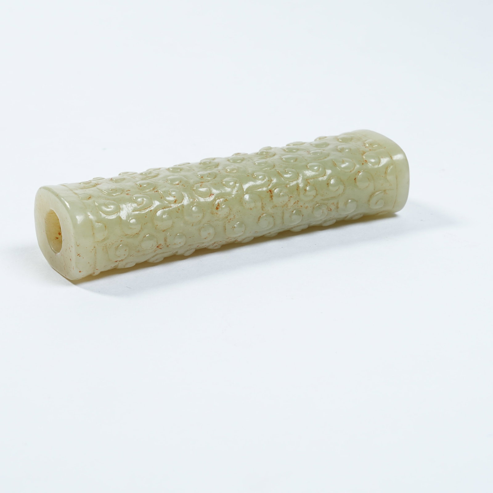 A ANCIENT JADE CYLINDRICAL BEAD WITH INTERLOCKING CLOUD PATTERNS - 6