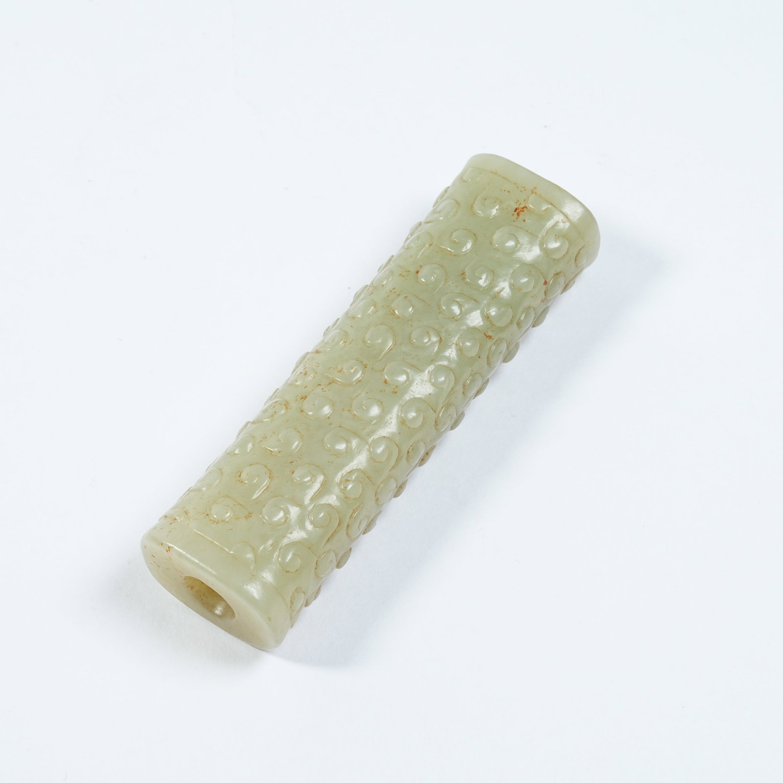 A ANCIENT JADE CYLINDRICAL BEAD WITH INTERLOCKING CLOUD PATTERNS - 8