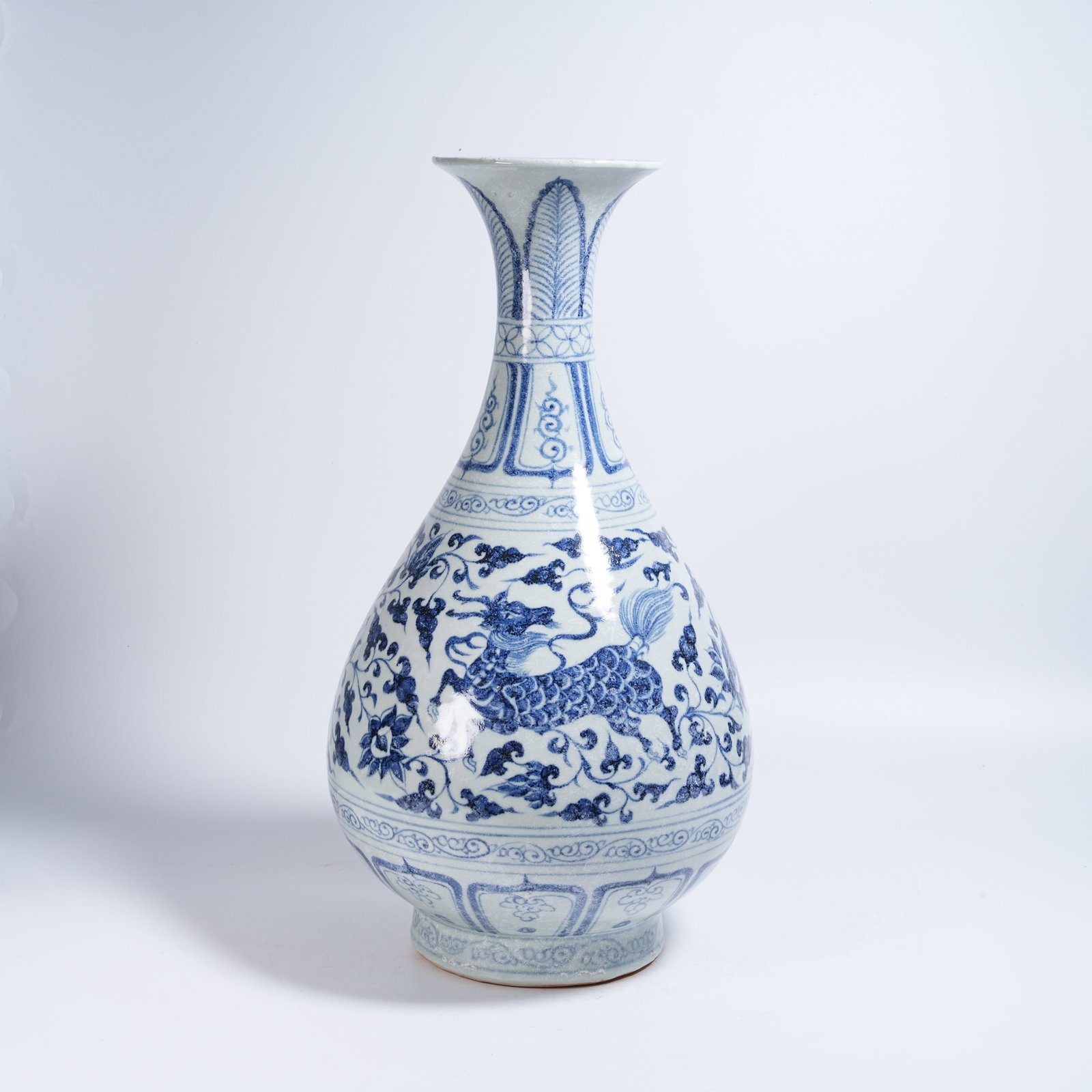 A BLUE AND WHITE PEAR-SHAPED VASE WITH BEASTS AMID FLORAL SCROLLS (1 of 9)