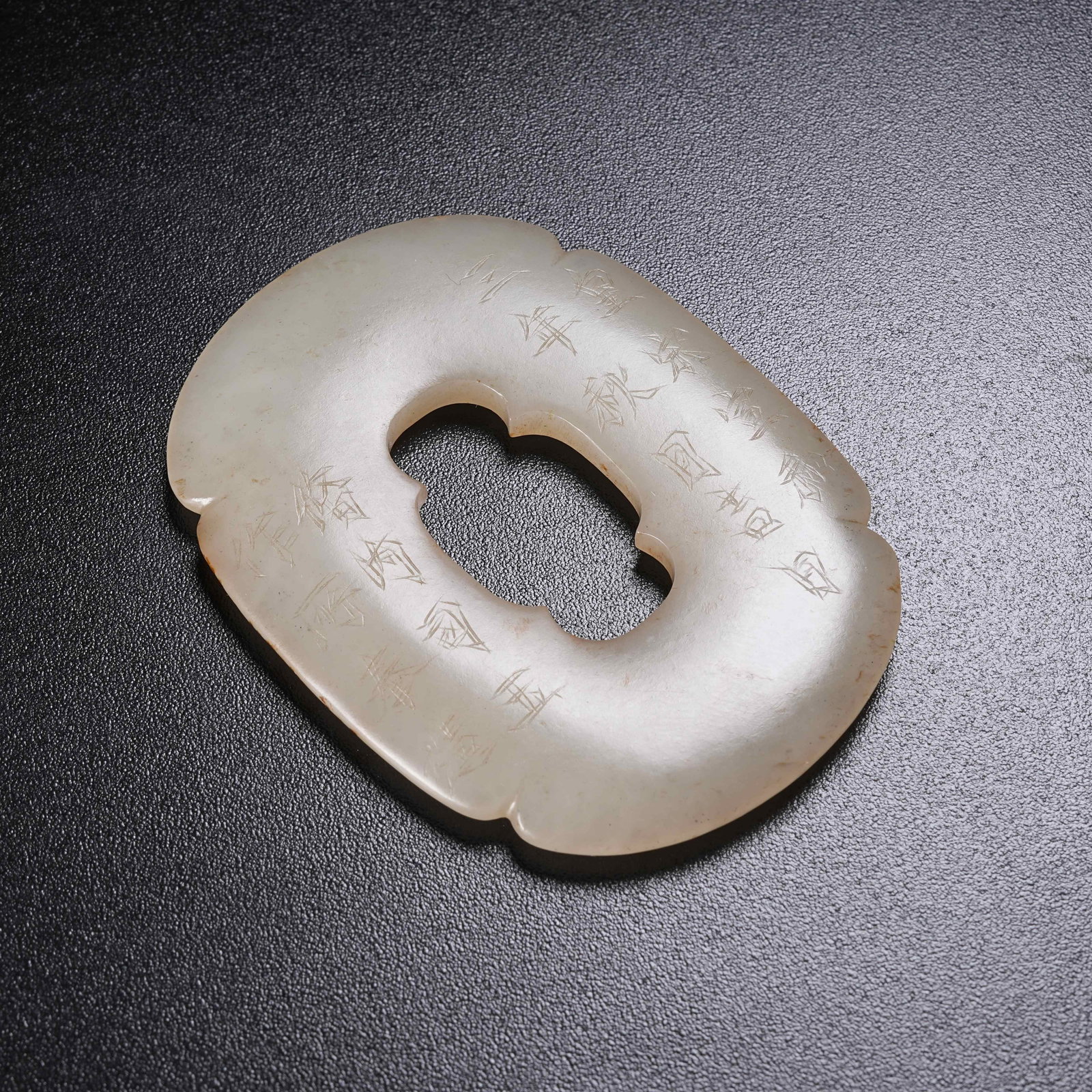 A HETIAN JADE BEGONIA-SHAPED BELT ORNAMENT: Hetian Jade Begonia-shaped Belt Ornament