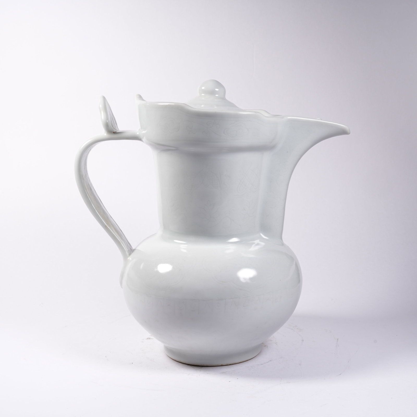 A WHITE PORCELAIN MONK'S CAP EWER: White Porcelain Monk's Cap Ewer