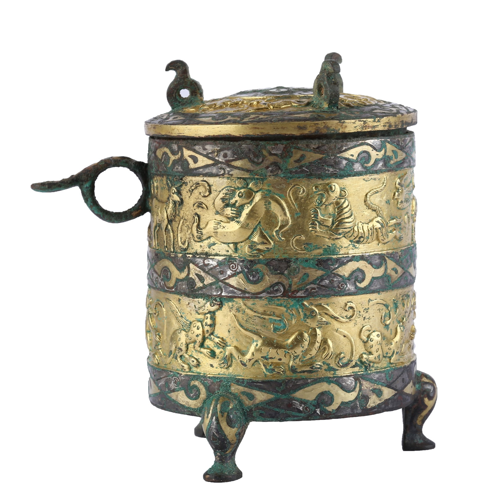 GILT BRONZE TRIPOD ZHI WINE VESSEL DECORATED WITH AUSPICIOUS BEAST PATTERNS, HAN DYNASTY: This gilded and silver-inlaid bronze three-legged zhi wine vessel decorated with auspicious beast patterns dates from the Han Dynasty, representing a classic type of Han wine container. It features a 
