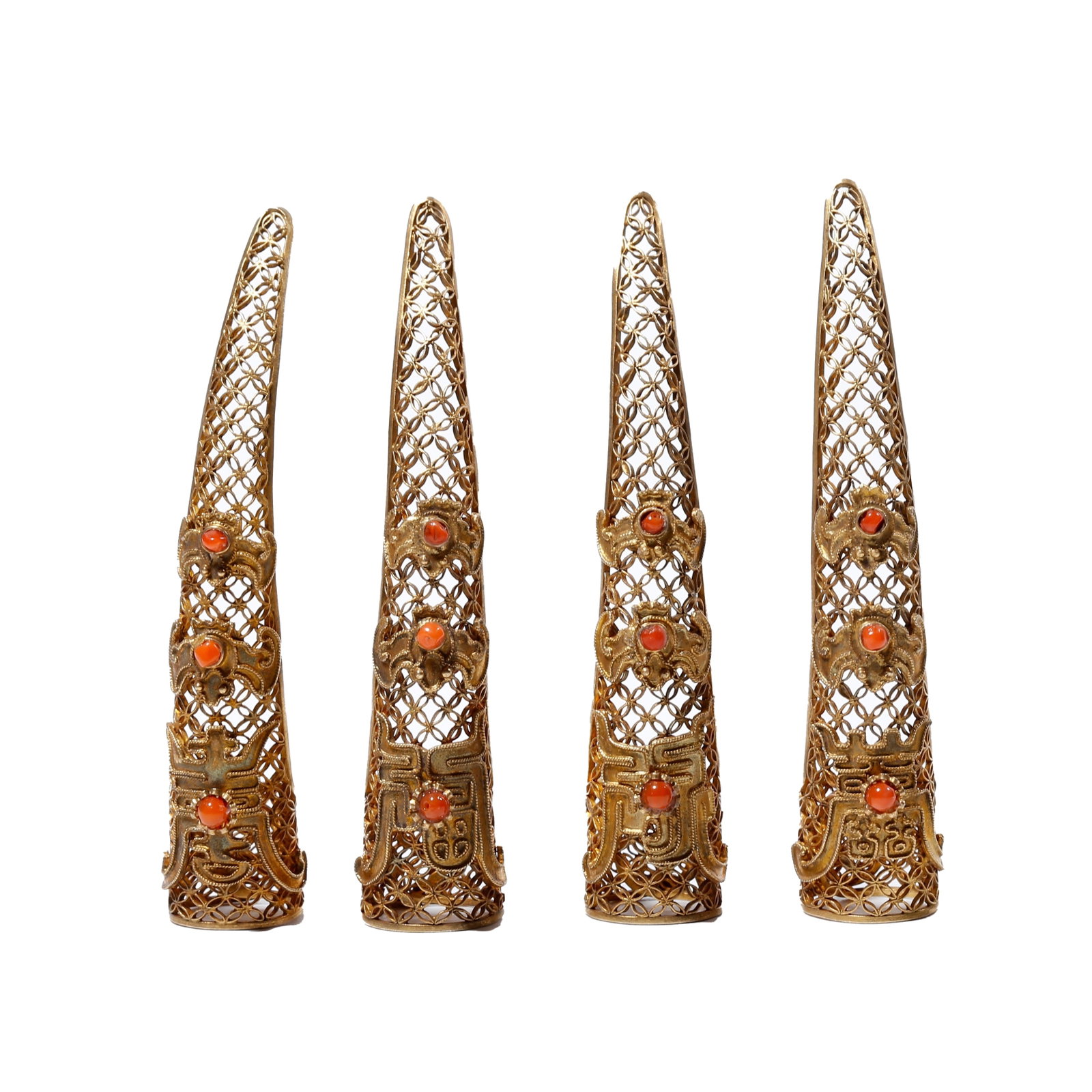 SET OF FOUR GILT SILVER GEM-INLAID NAIL GUARDS WITH FORTUNE AND LONGEVITY MOTIFS, QING DYNASTY: This set of ornaments was exclusively used by imperial concubines in the Qing palace, crafted with gilded silver filigree technique and hollowed patterns symbolizing fortune and longevity, embellished
