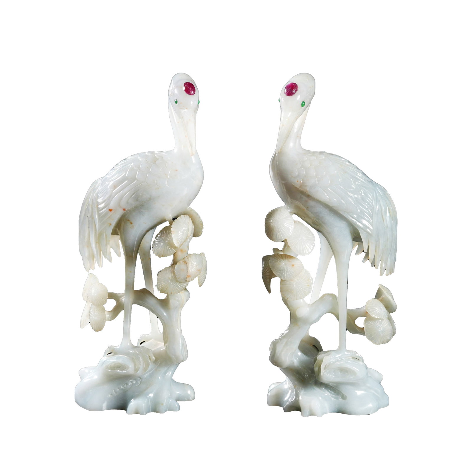 PAIR OF JADEITE ORNAMENTS INLAID WITH GEMSTONES DEPICTING PINES AND CRANES, QING DYNASTY: This is an exquisite imperial display artwork of the Qing Dynasty. Carved from fine, mild jadeite, it depicts red-crowned cranes standing on pine branches with meticulously and neatly carved feathers,
