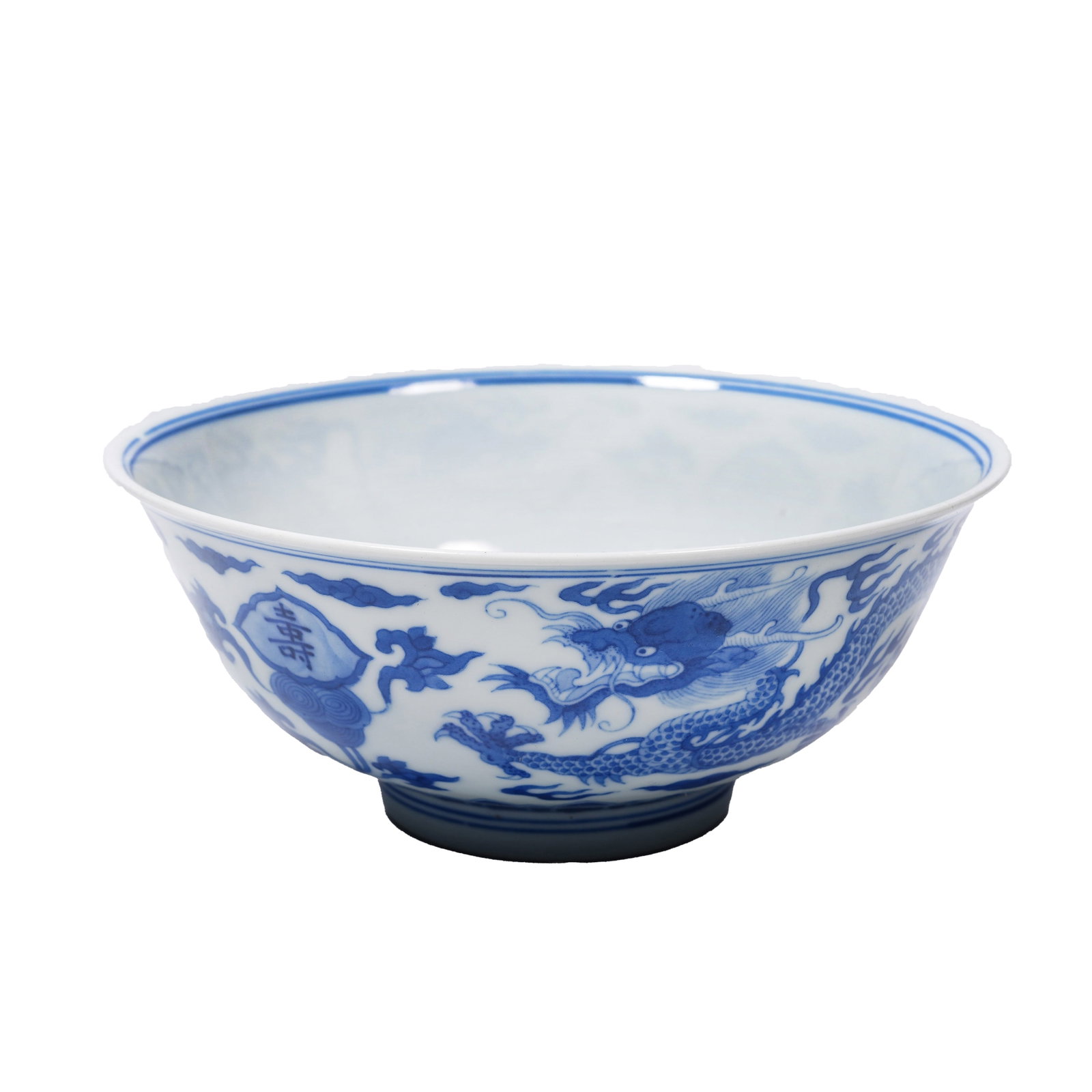 BLUE AND WHITE BOWL DECORATED WITH CLOUD DRAGONS, FORTUNE AND LONGEVITY MOTIFS, KANGXI PERIOD, QING: Made in the Kangxi reign of this dynasty, this vessel features a neat shape with a wide opening and deep belly. Its body is solid, white and fine, covered with smooth and glossy glaze. The whole surfa